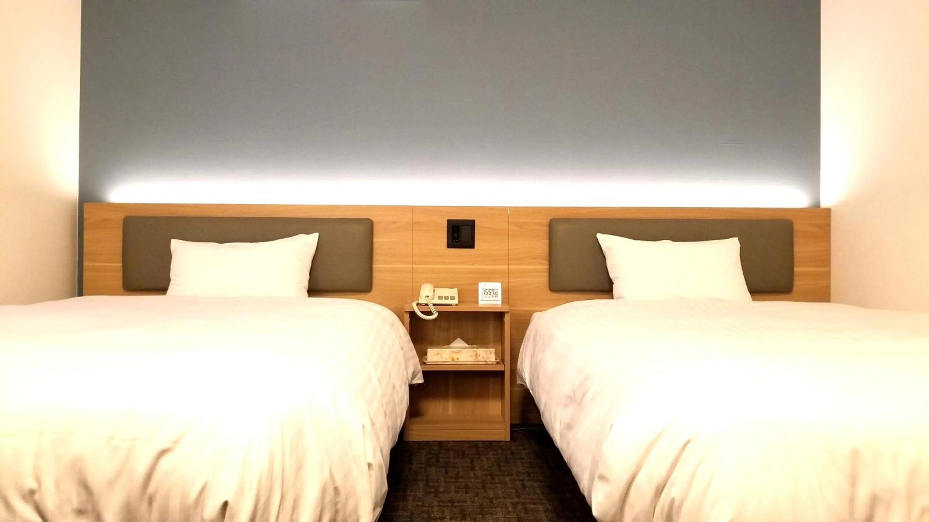 Bed in Kochi Sunrise Hotel