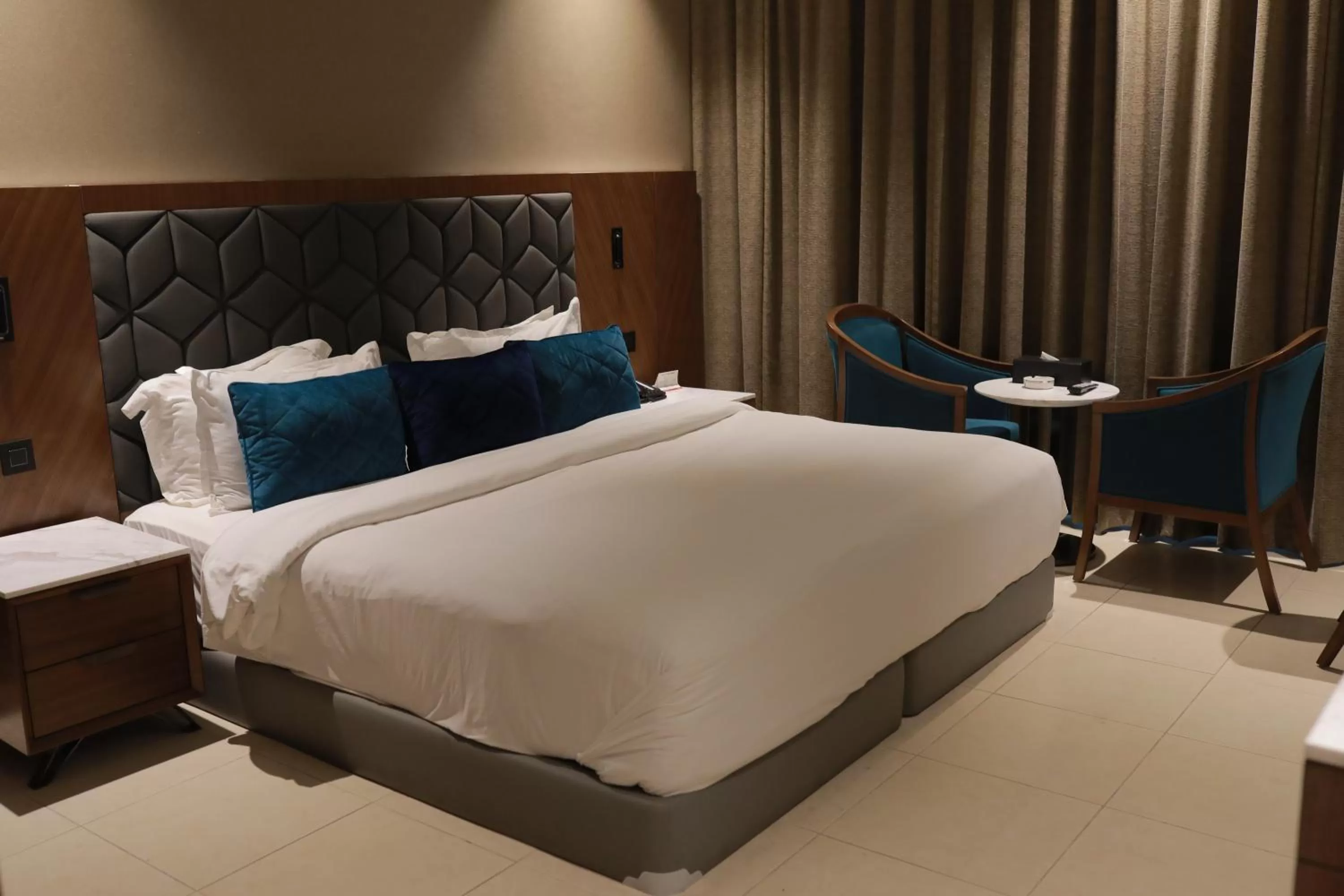 Bed in Ramee Palace Hotel