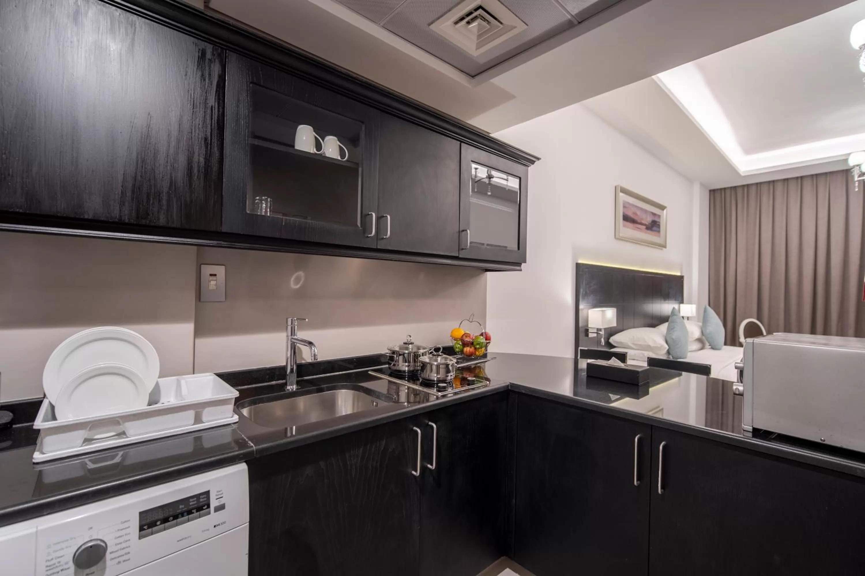 Kitchen or kitchenette in Rose Garden Hotel Apartments - Al Barsha, Near Metro Station