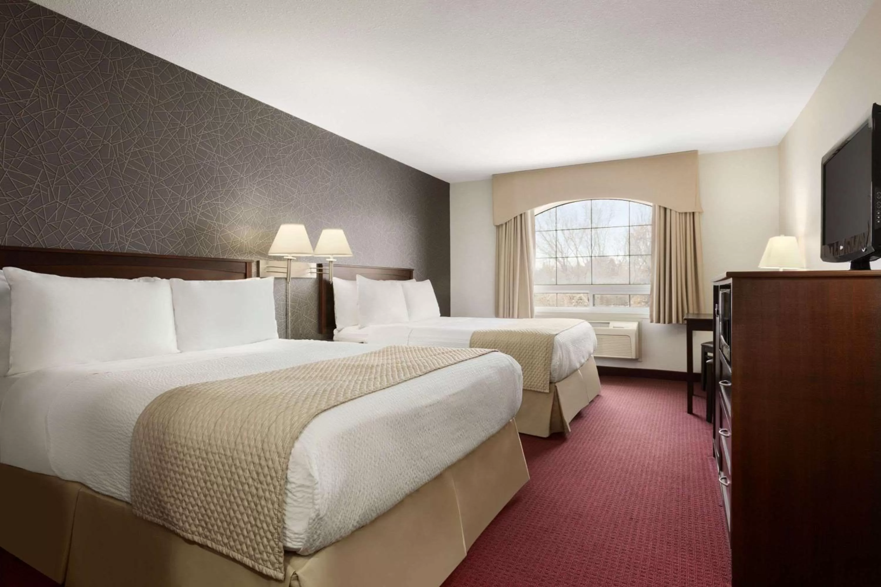 Photo of the whole room, Bed in Days Inn & Suites by Wyndham Brandon