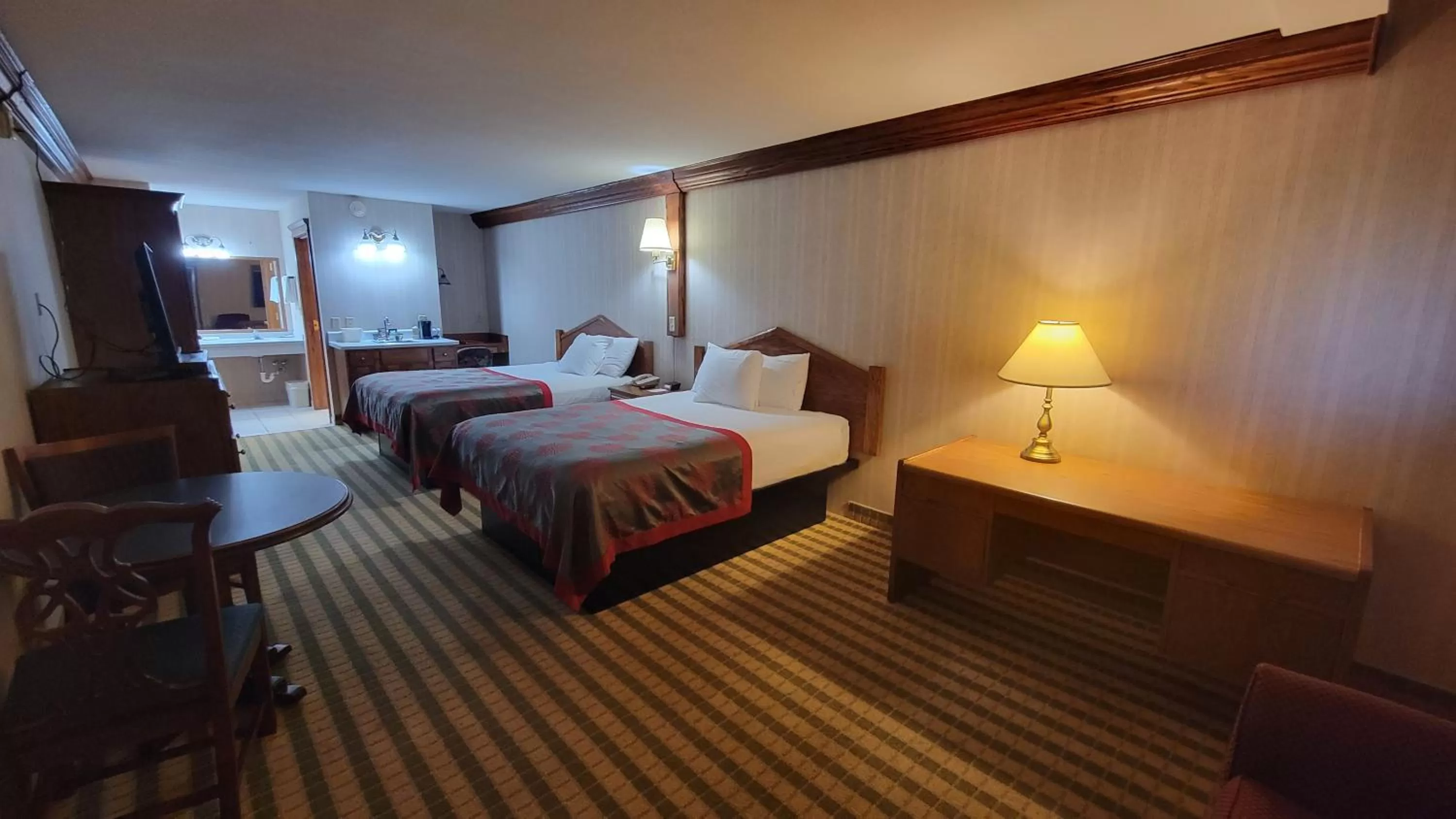 Photo of the whole room, Bed in Ramada by Wyndham Saginaw Hotel & Suites