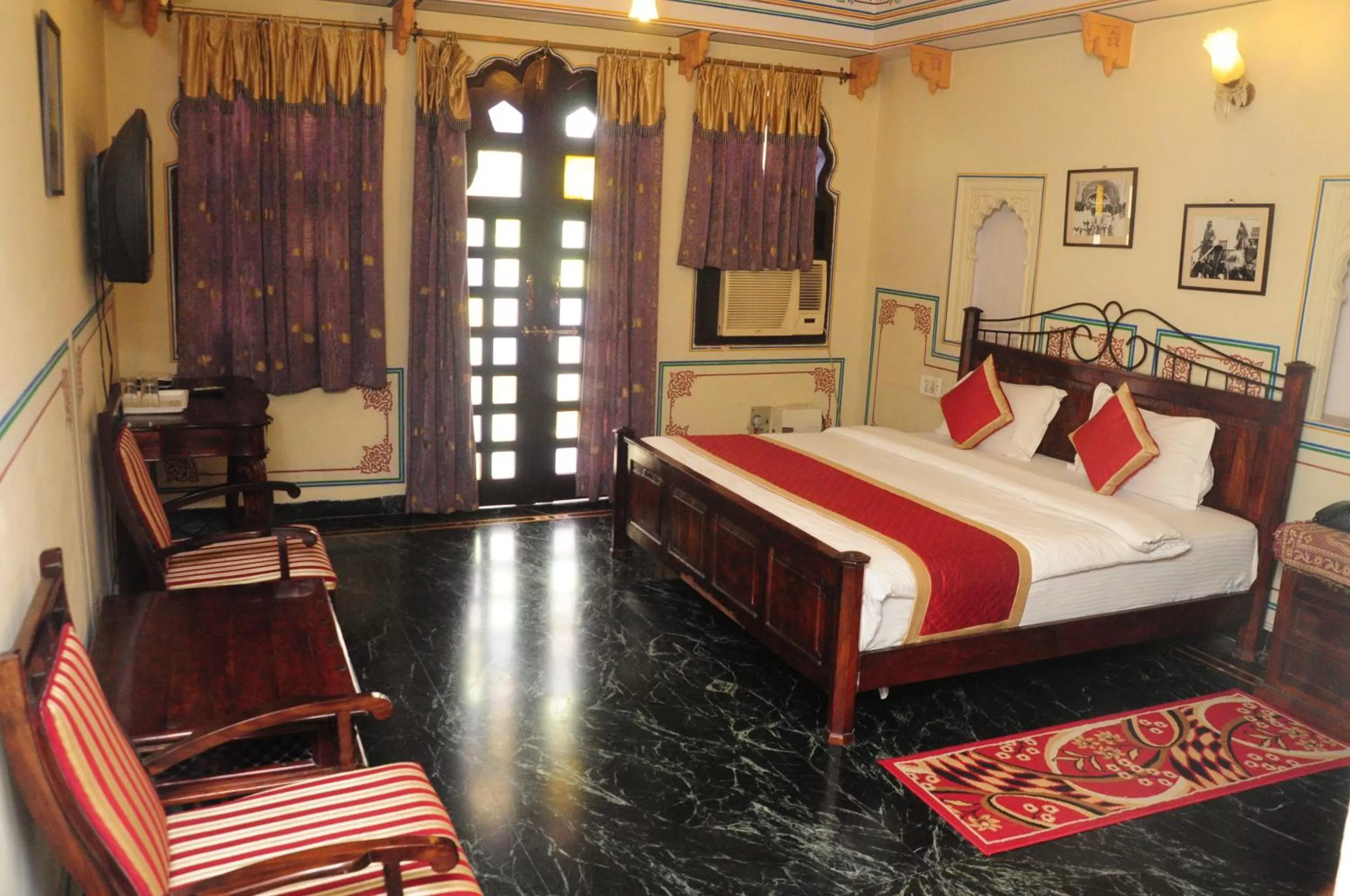 Photo of the whole room, Bed in Sajjan Niwas