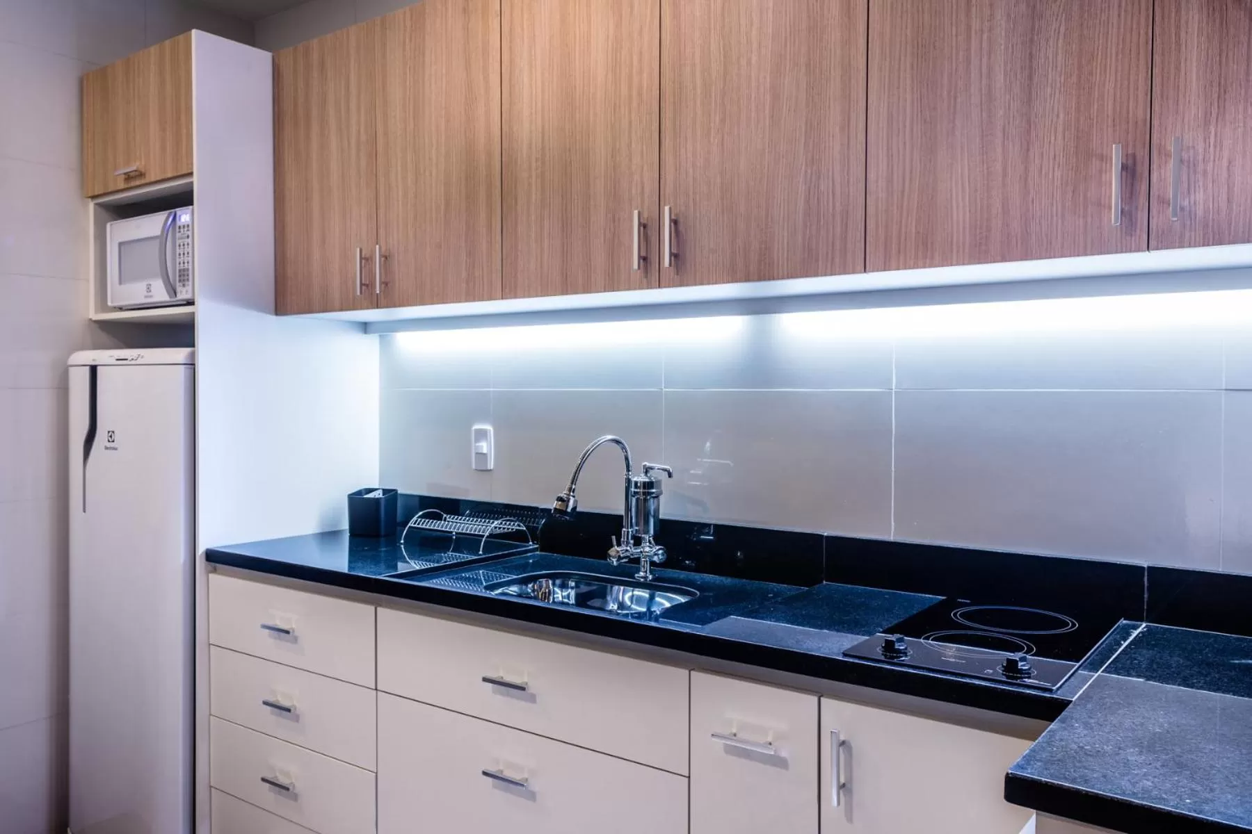 Kitchen or kitchenette in Injoy Suítes & Aparts