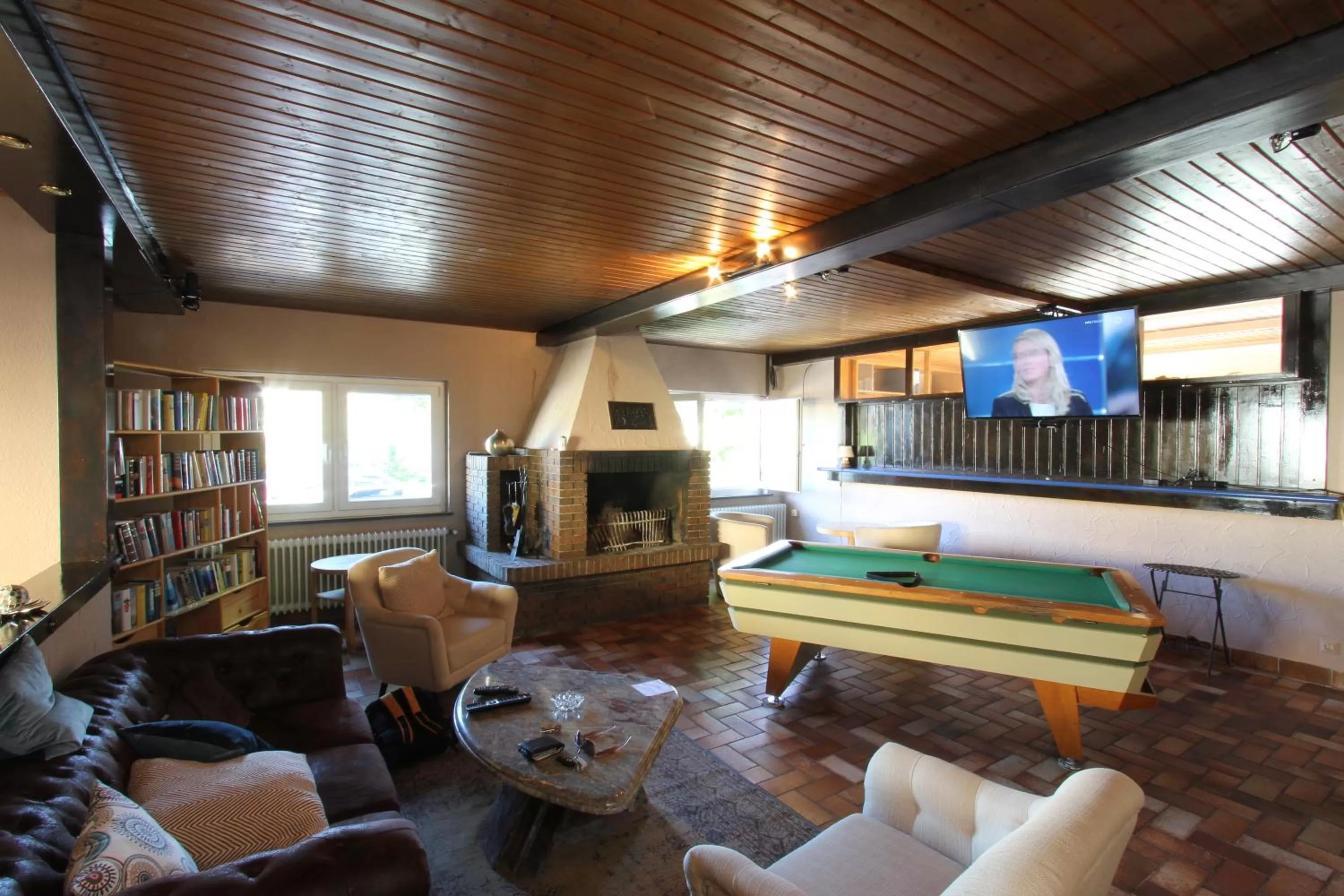 Communal lounge/ TV room, Seating Area in Hotel Lowen by Mastiff