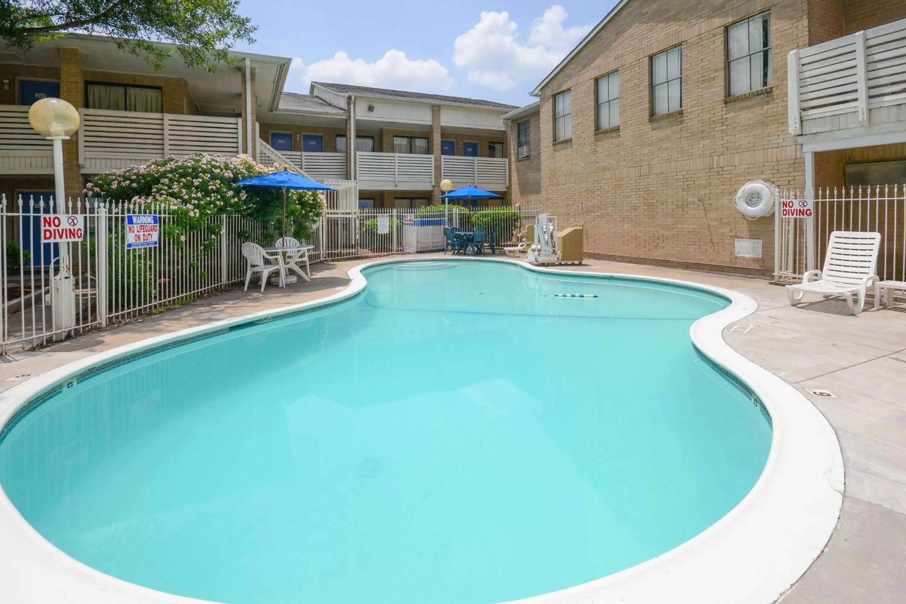 Pool view in Motel 6-Baytown, TX - Baytown East