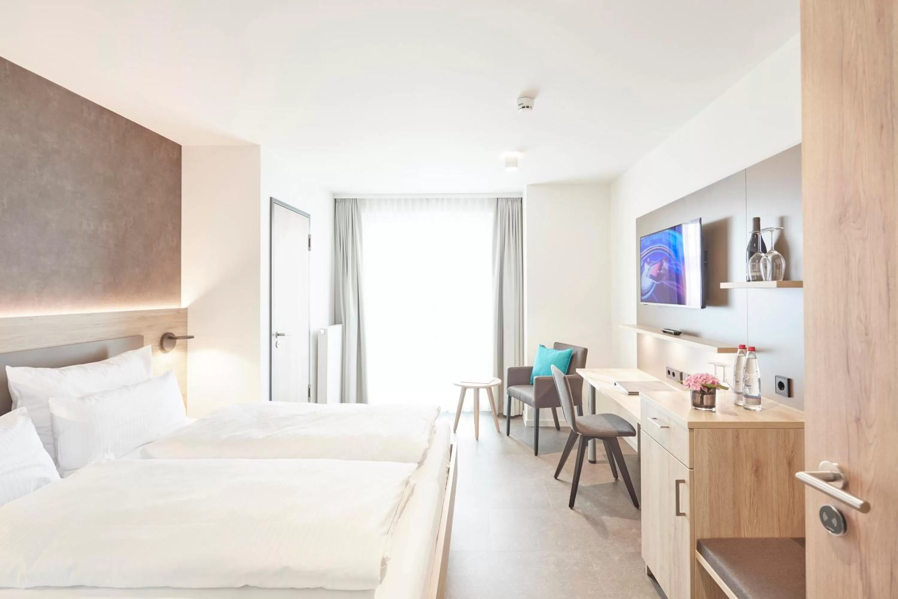 Bed in Gästehaus Bauer - Schlafen auf dem Weingut