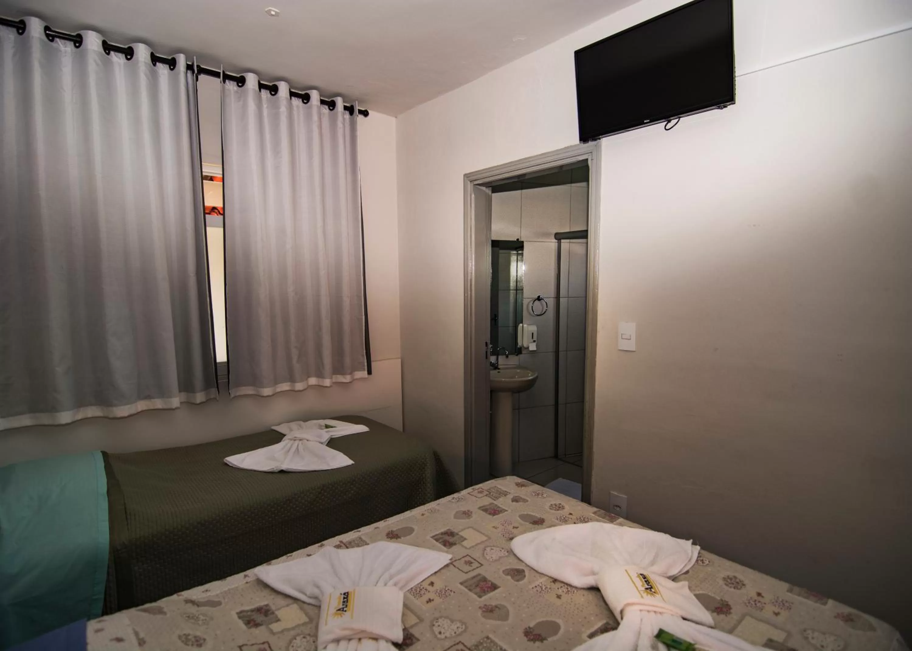 Bed in Pousada Araxá