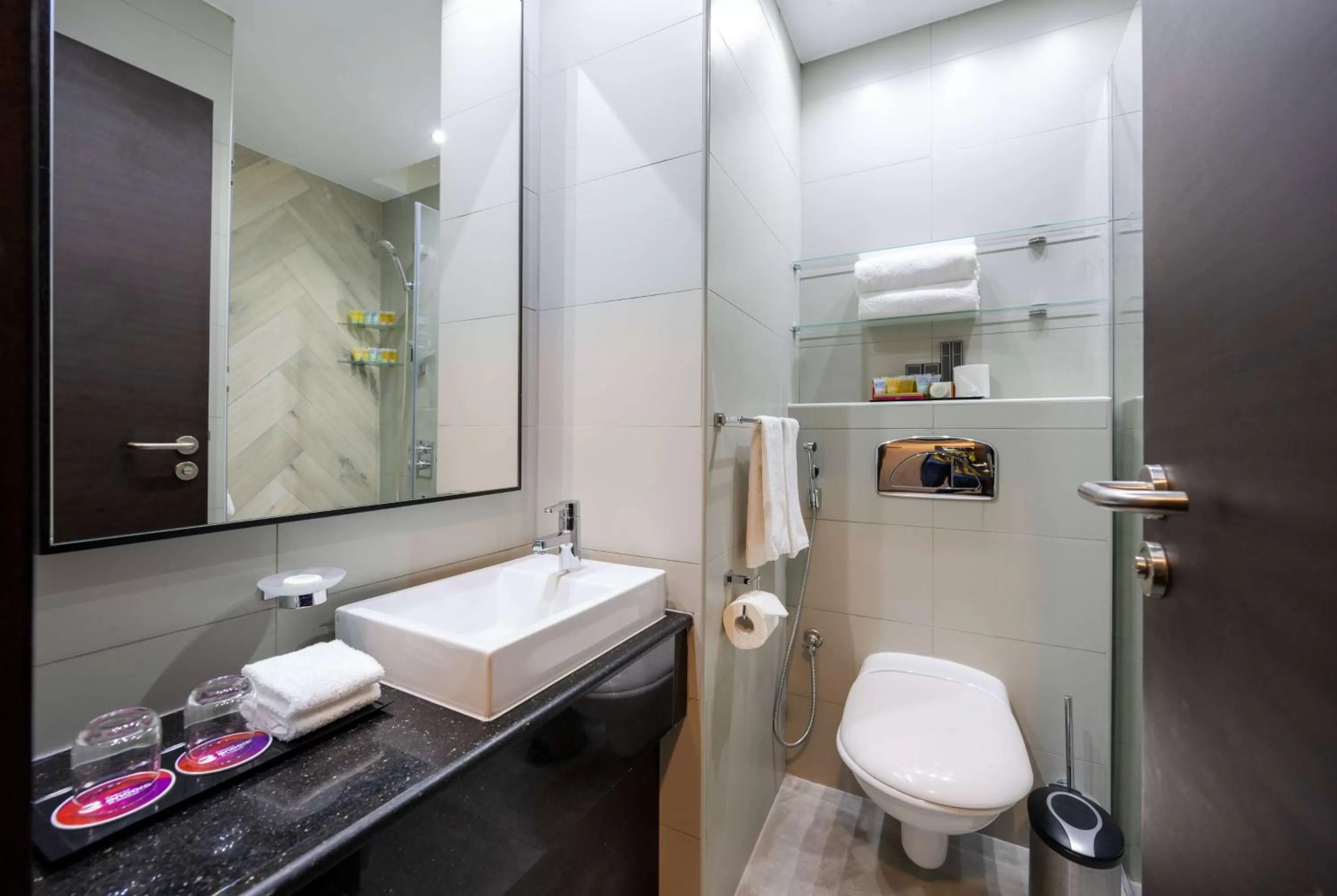 TV and multimedia in Ramada Encore Doha by Wyndham