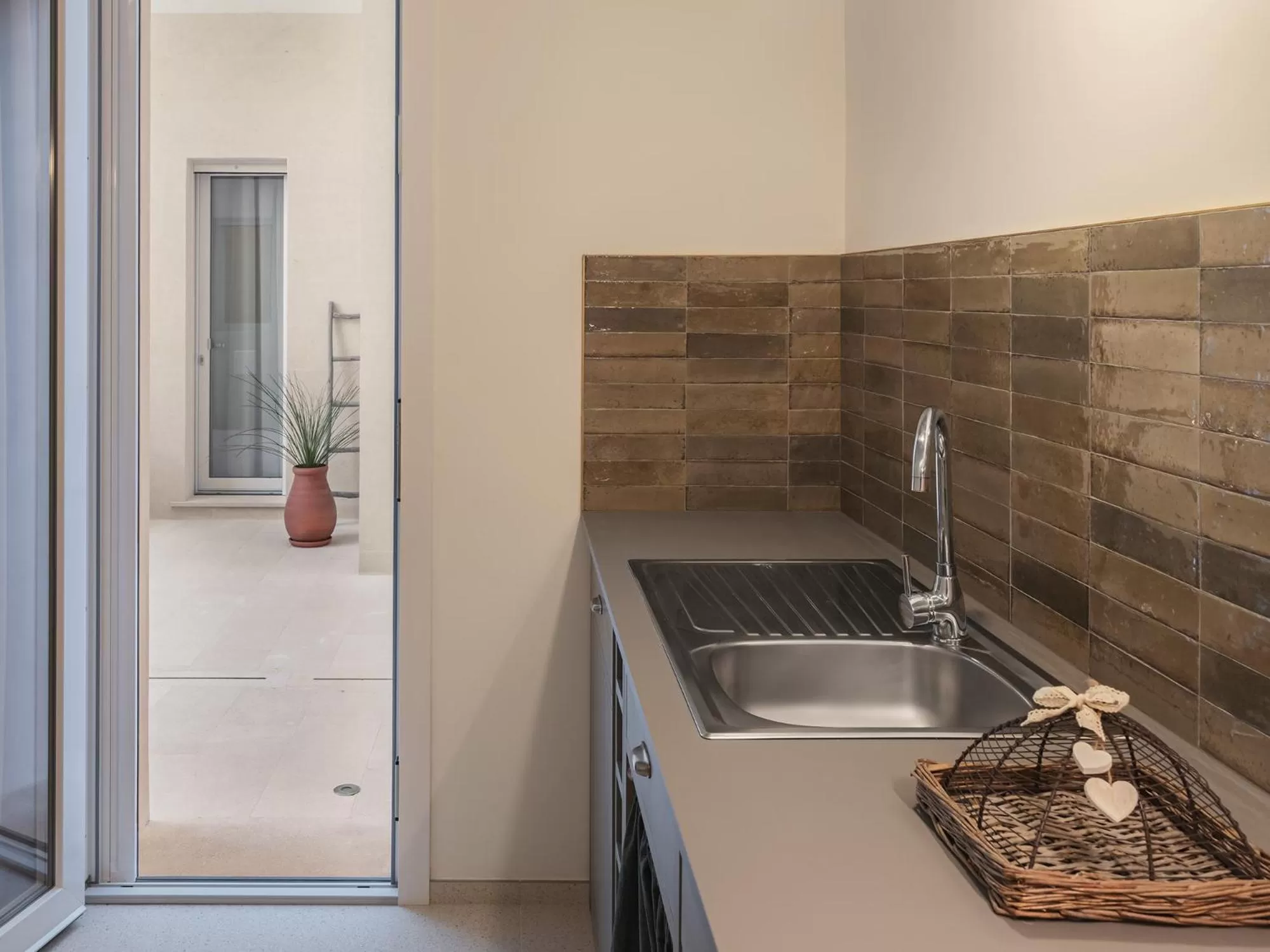 Kitchen or kitchenette in Living u HomeSuites