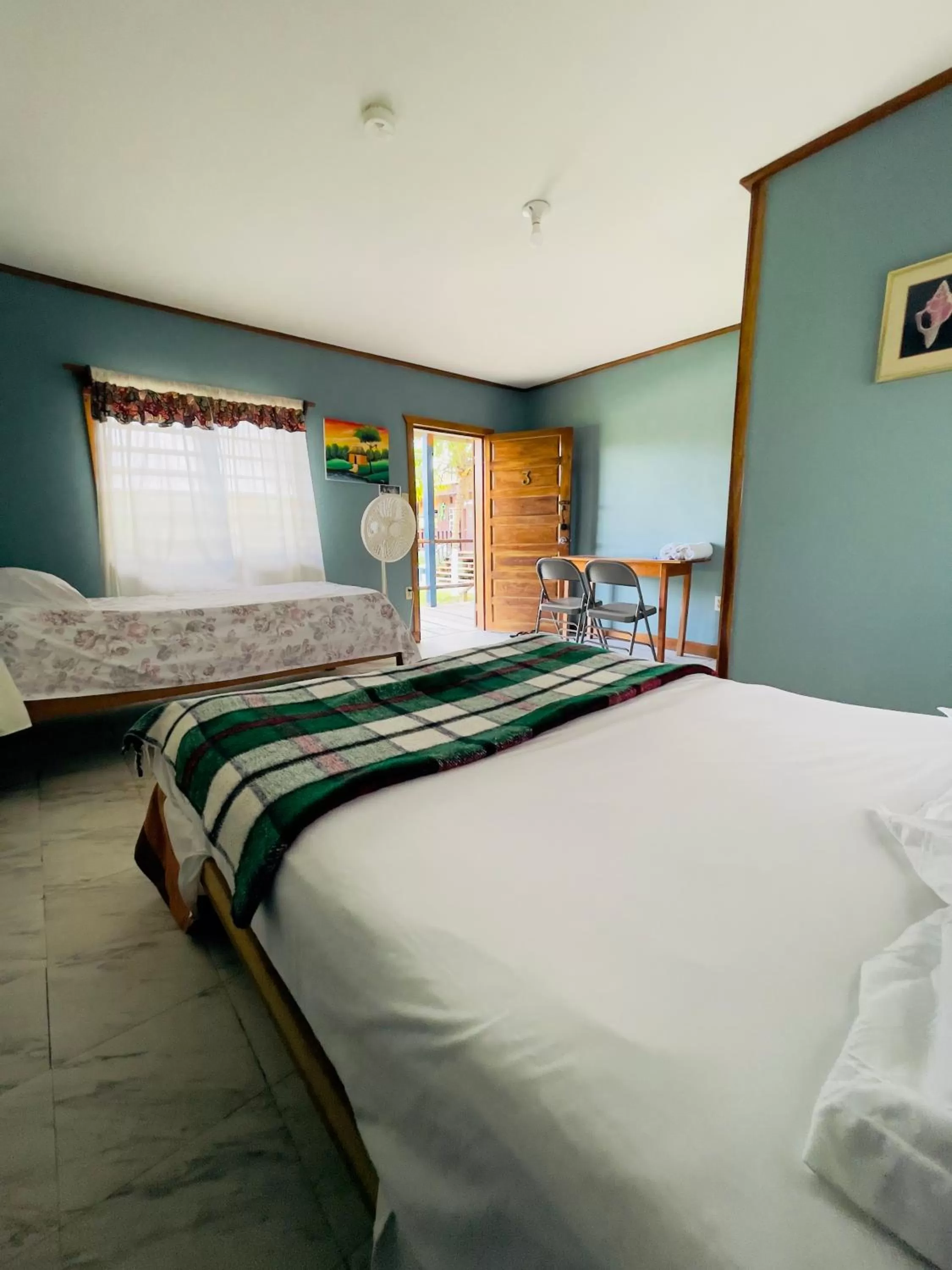 Bed in Lamanai Riverside Retreat