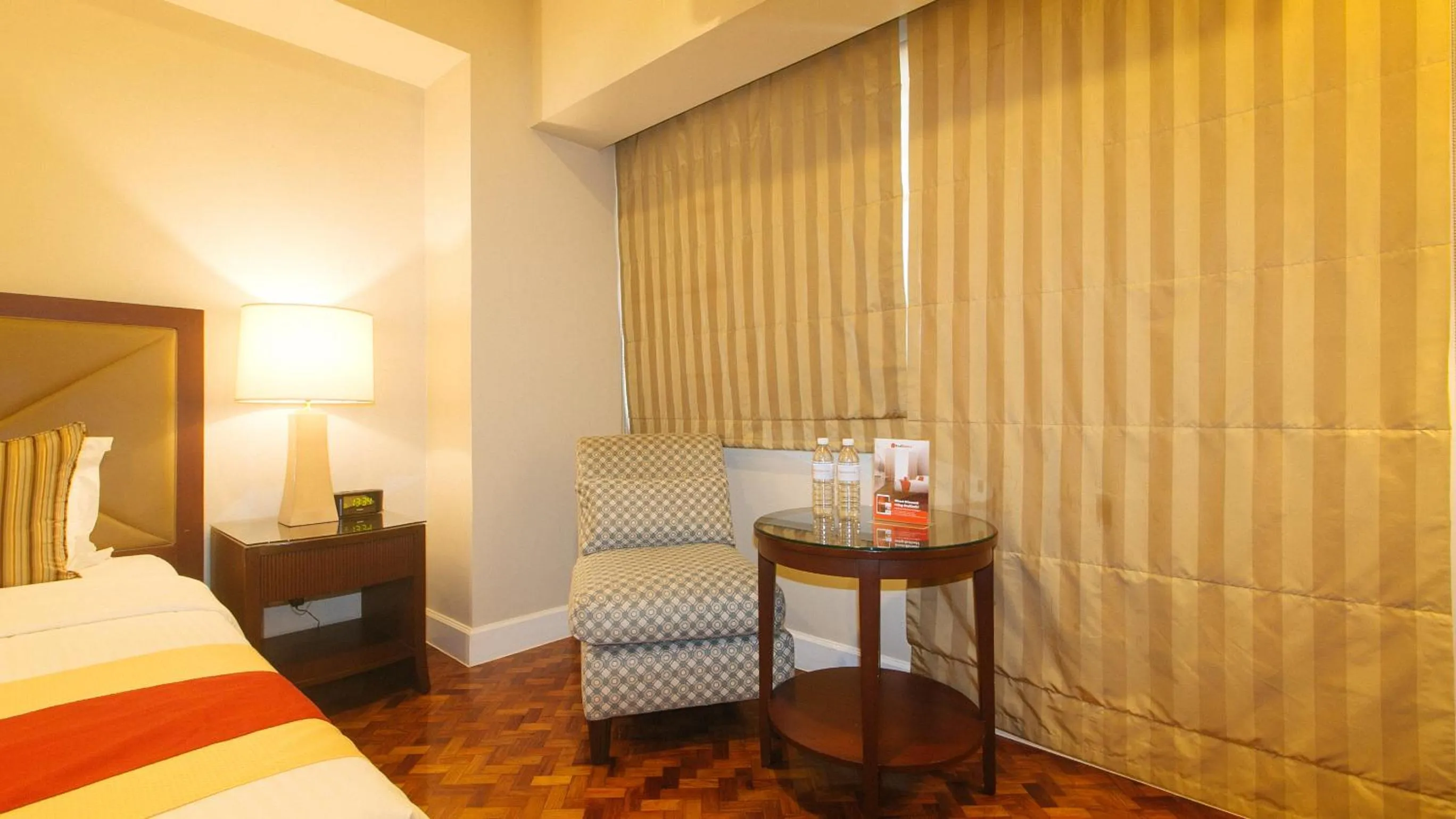 Seating area in RedDoorz Premium at The Residences Olympia Makati