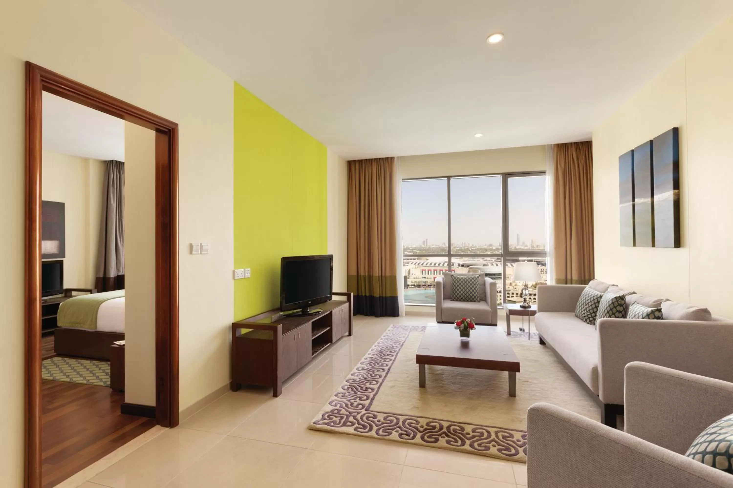 Living room, Bed in Ramada by Wyndham Downtown Dubai