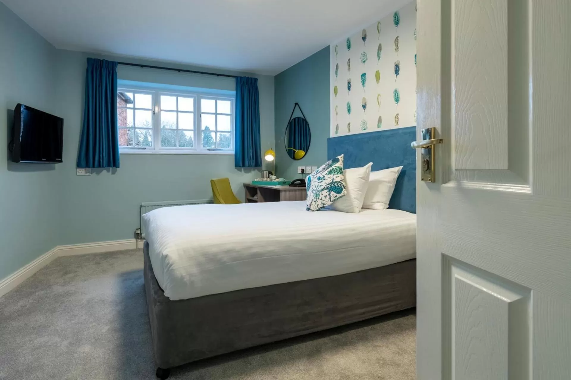 Bed in Wisteria Hotel