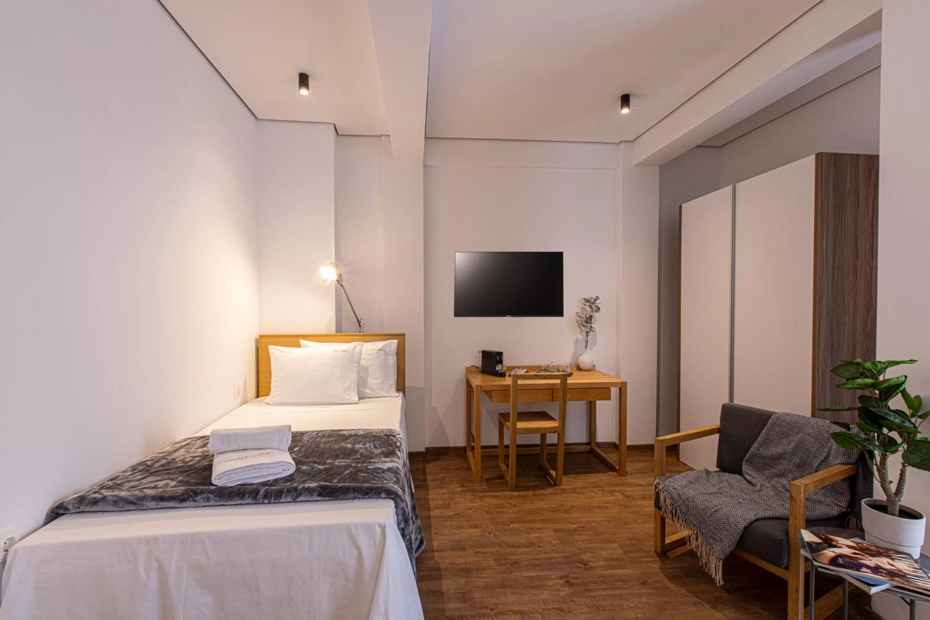 Bed in Saint George Boutique Rooms