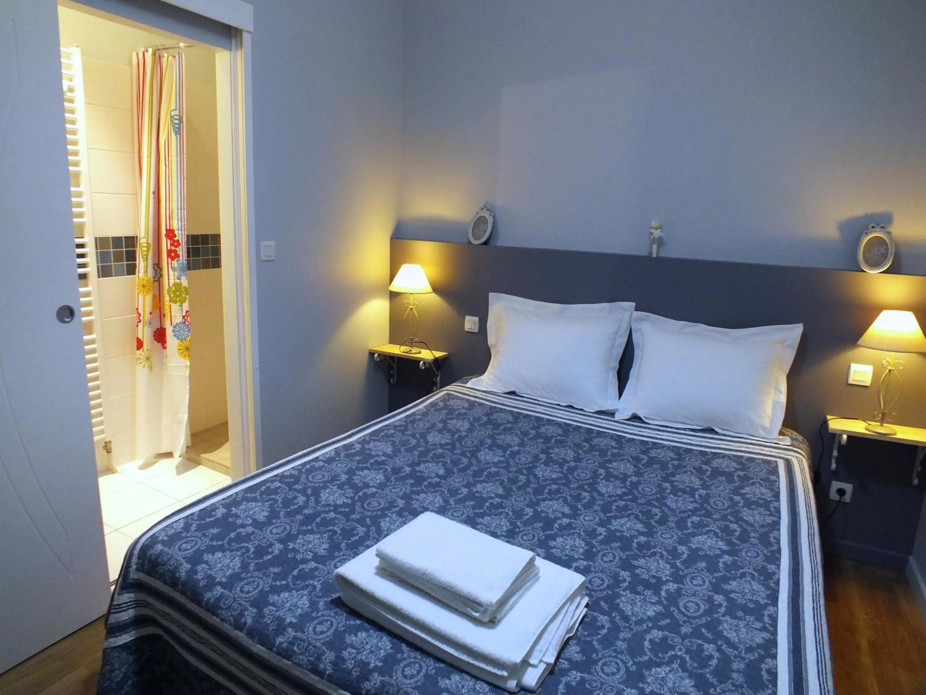 Photo of the whole room, Bed in A la Fleur de Lys