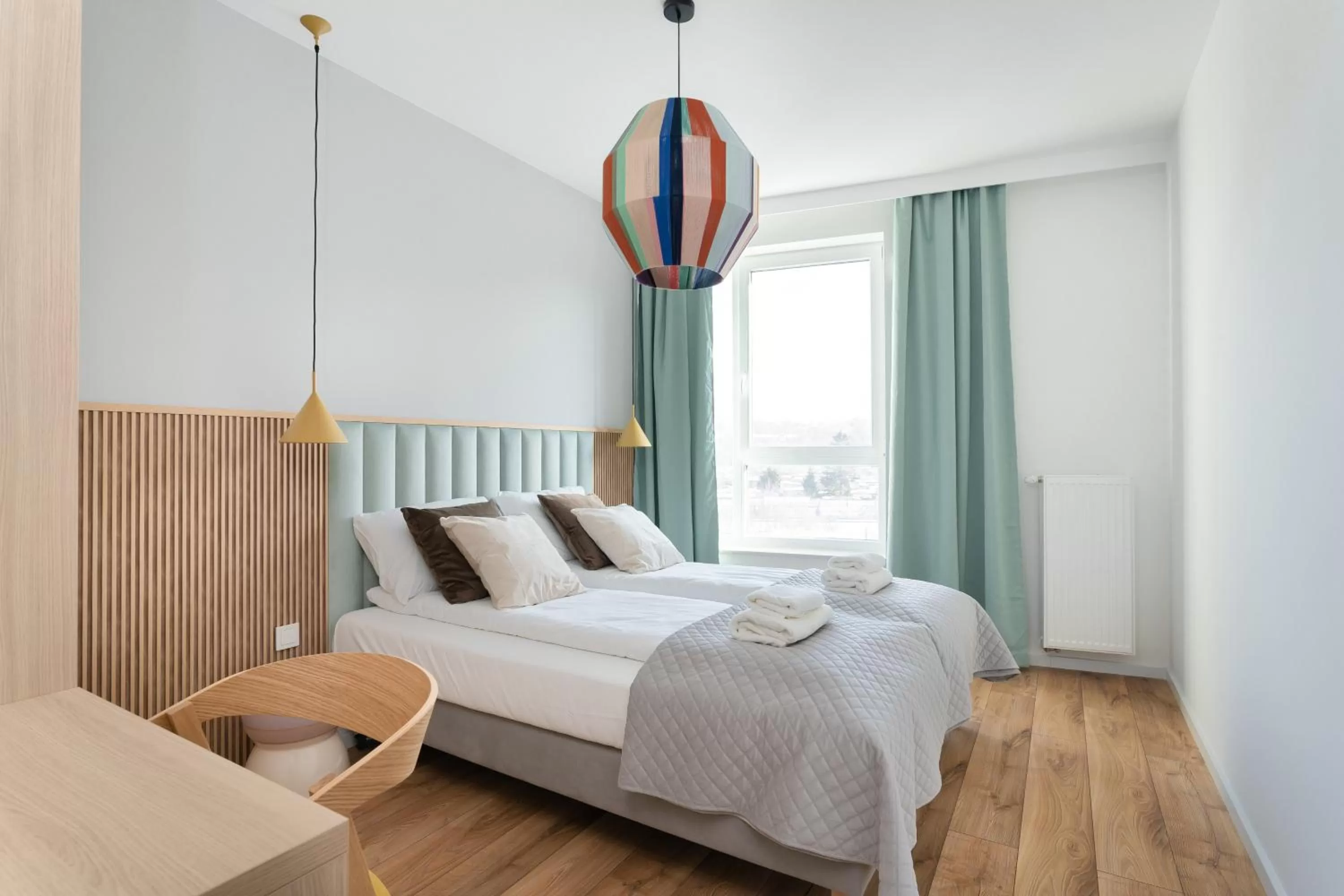 Bed in Symphony Modern Tower Apartamenty