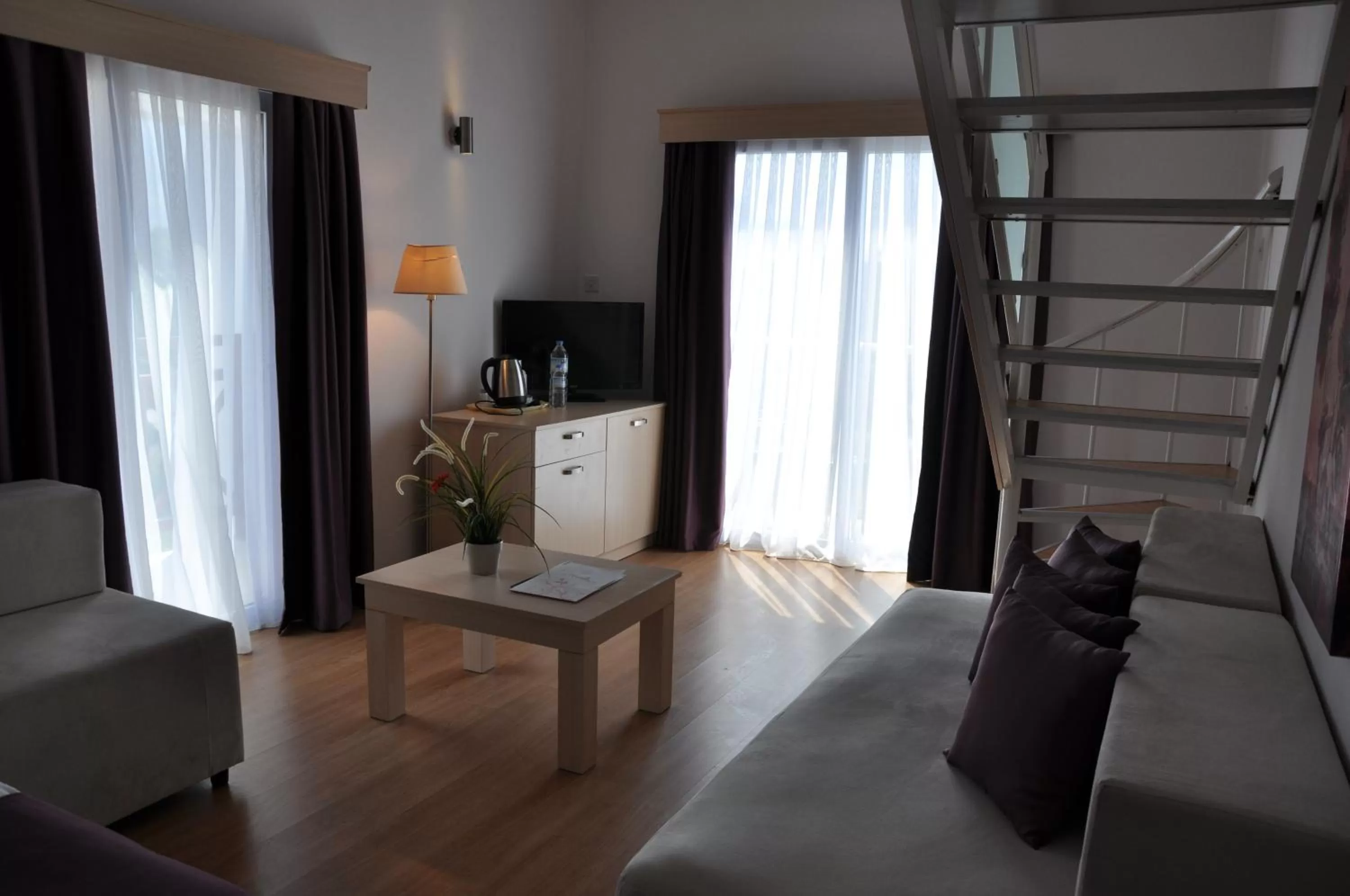 Communal lounge/ TV room in Manolya Hotel