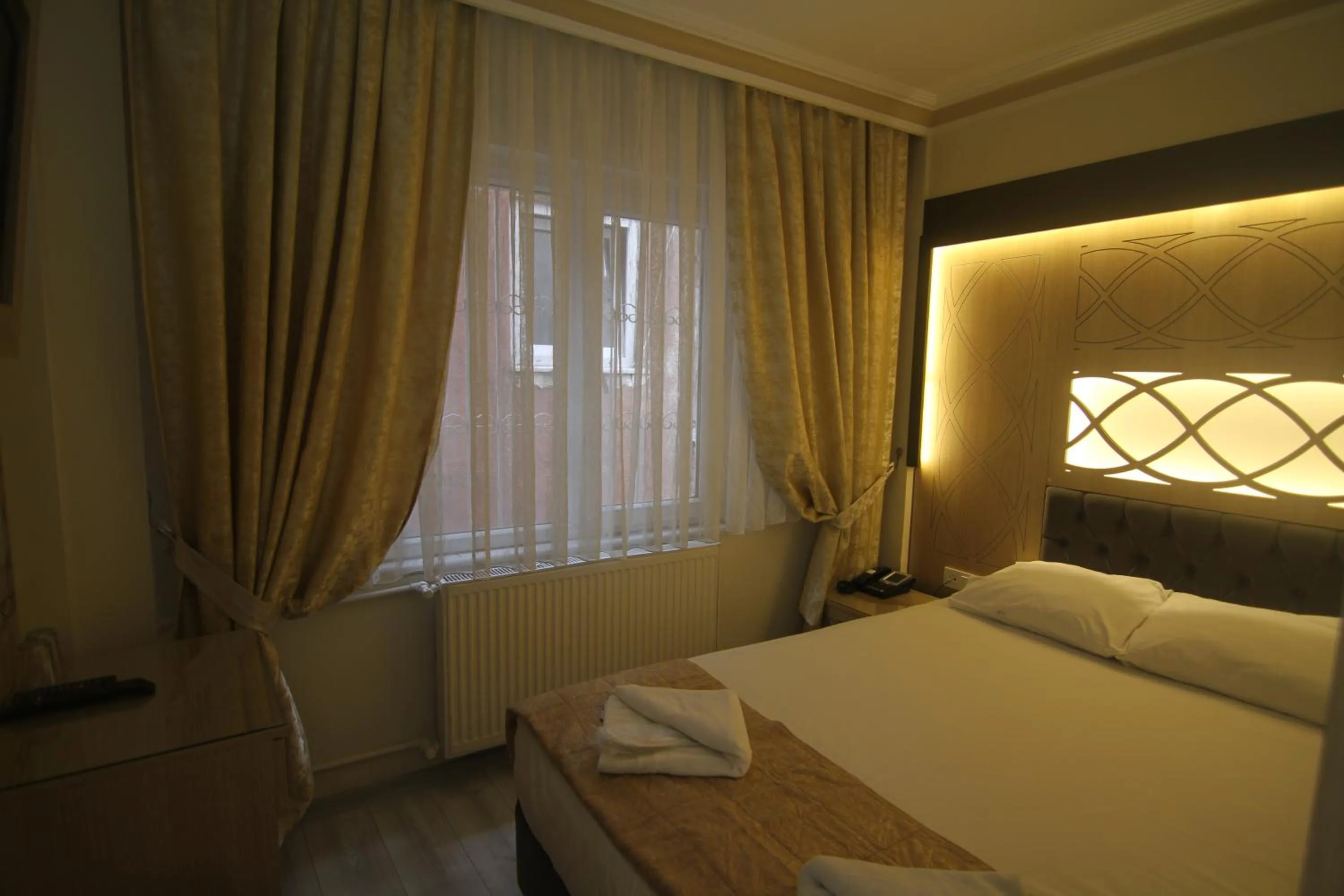 Bed in Grand Liza Hotel