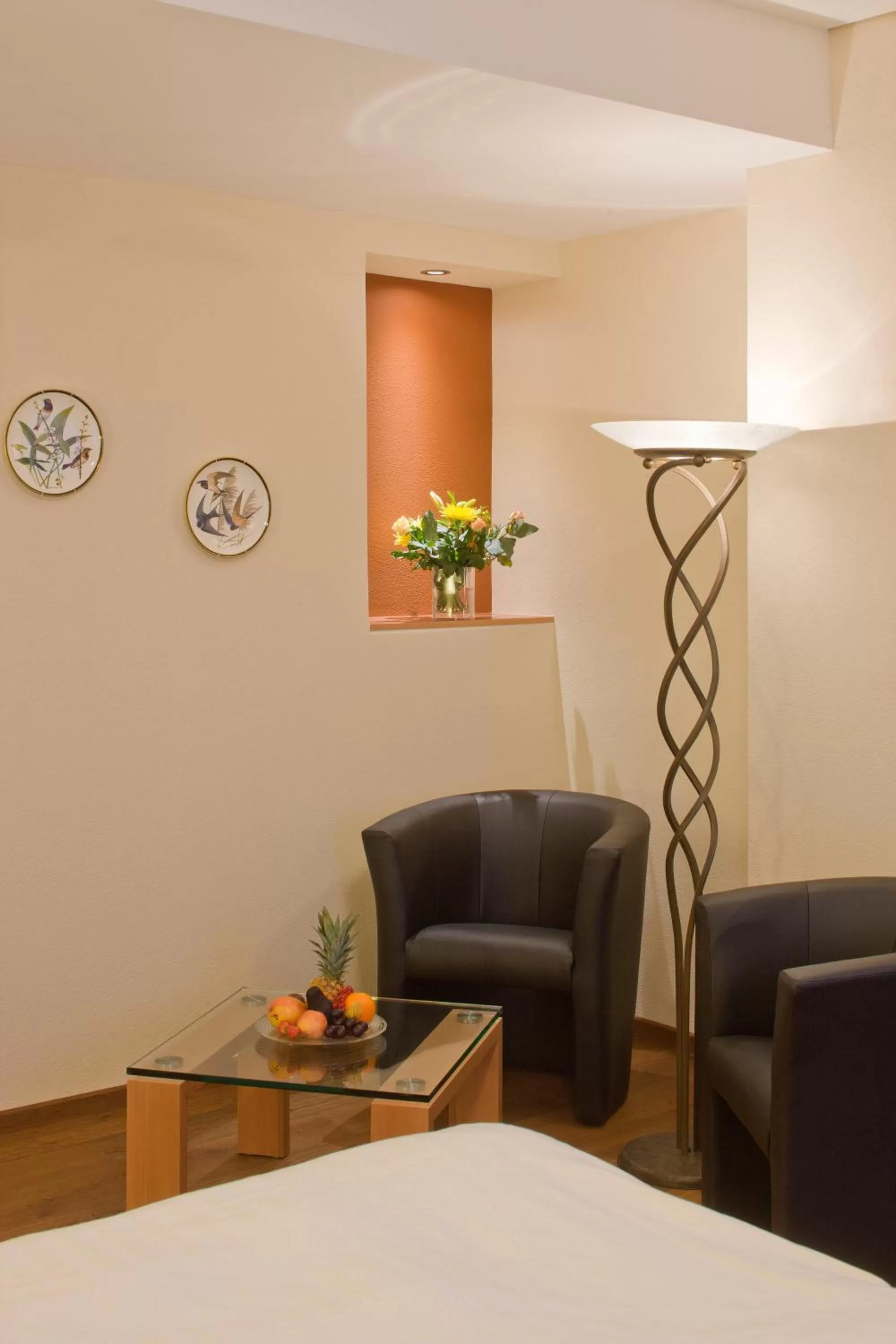 Seating area, Bed in Hotel Ambassador