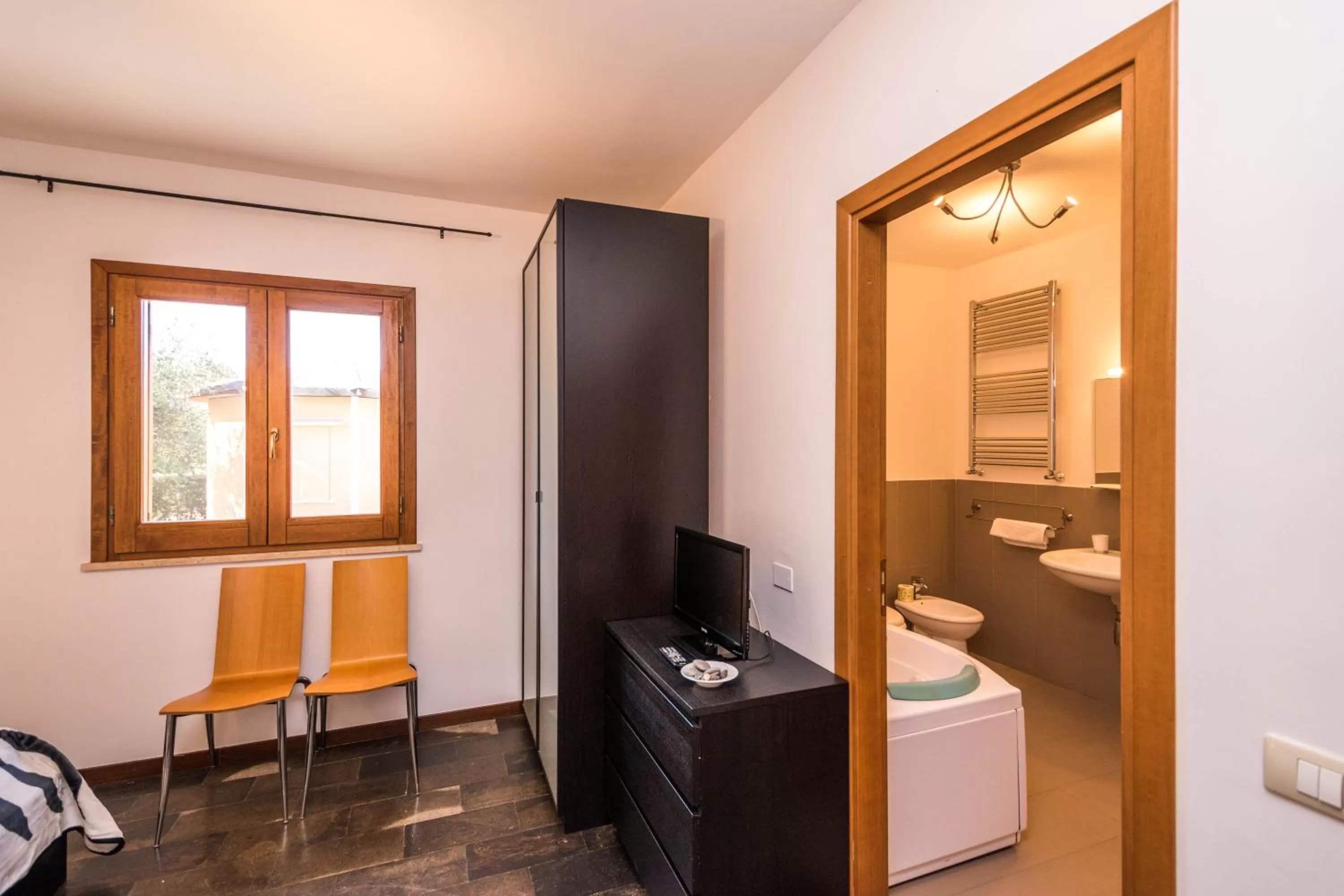 Bedroom, TV/Entertainment Center in B&B Le Dune - Self Check in