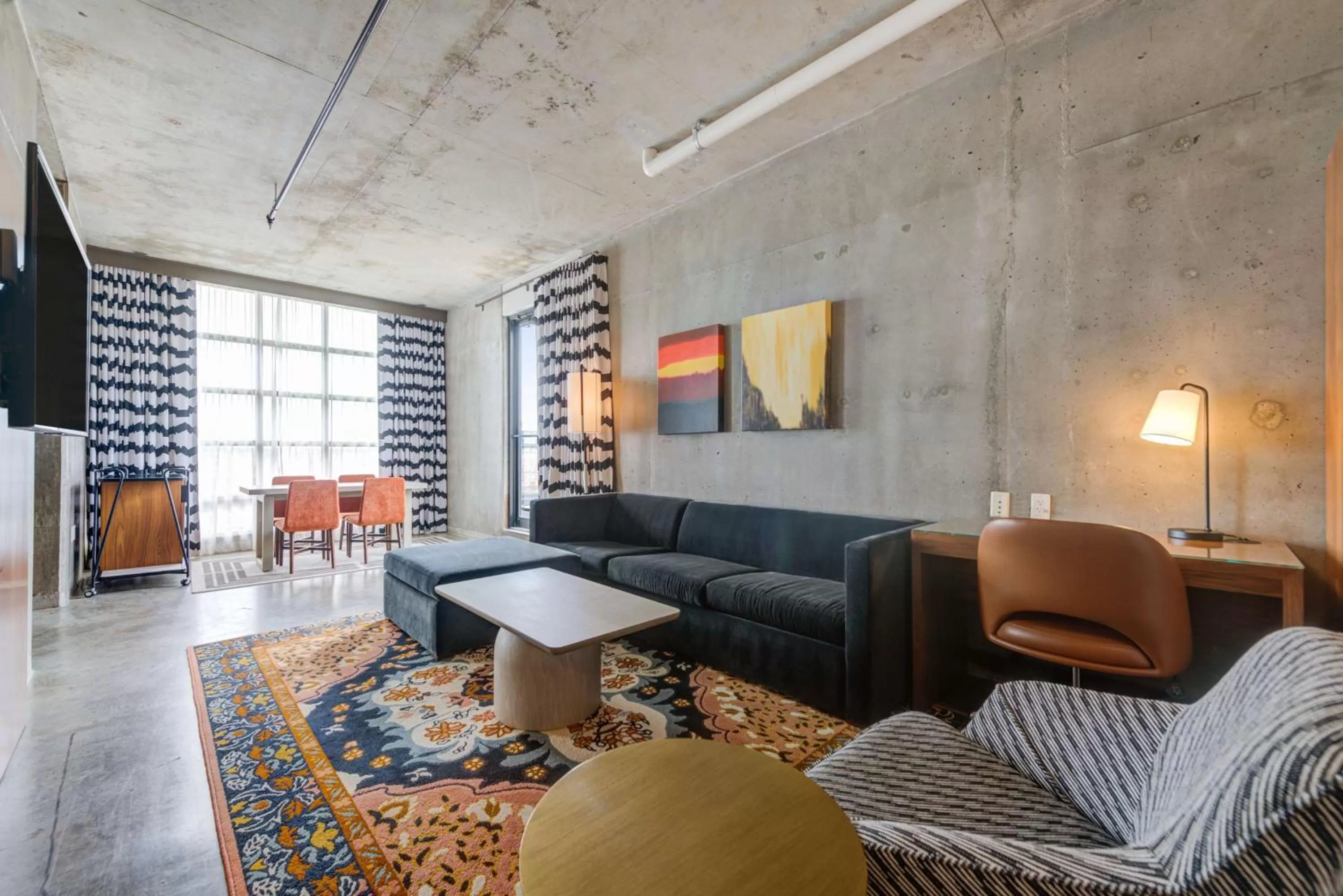 Living room in NYLO Dallas Plano Hotel, Tapestry Collection by Hilton