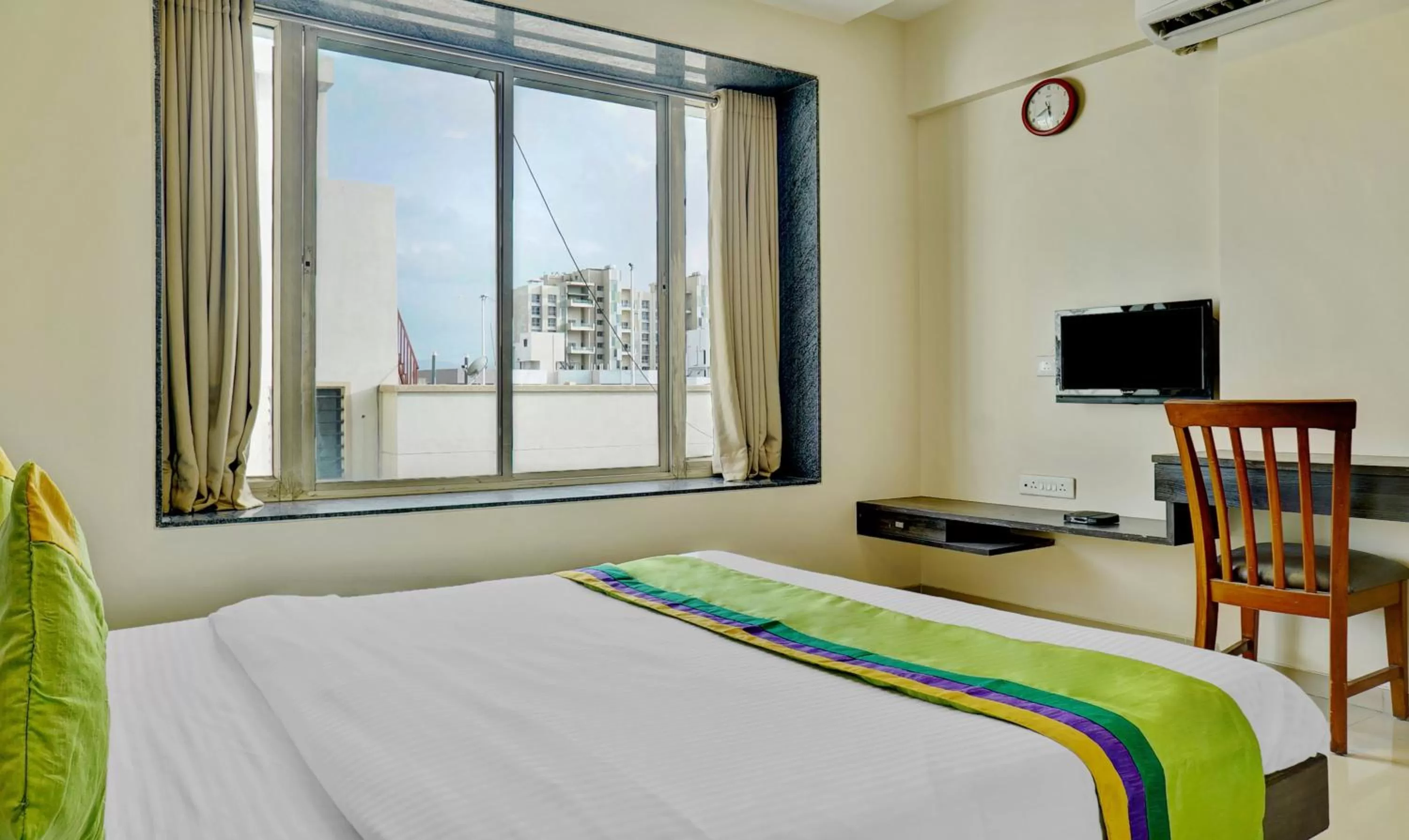 Bedroom, Bed in Treebo Bhagyashree Executive