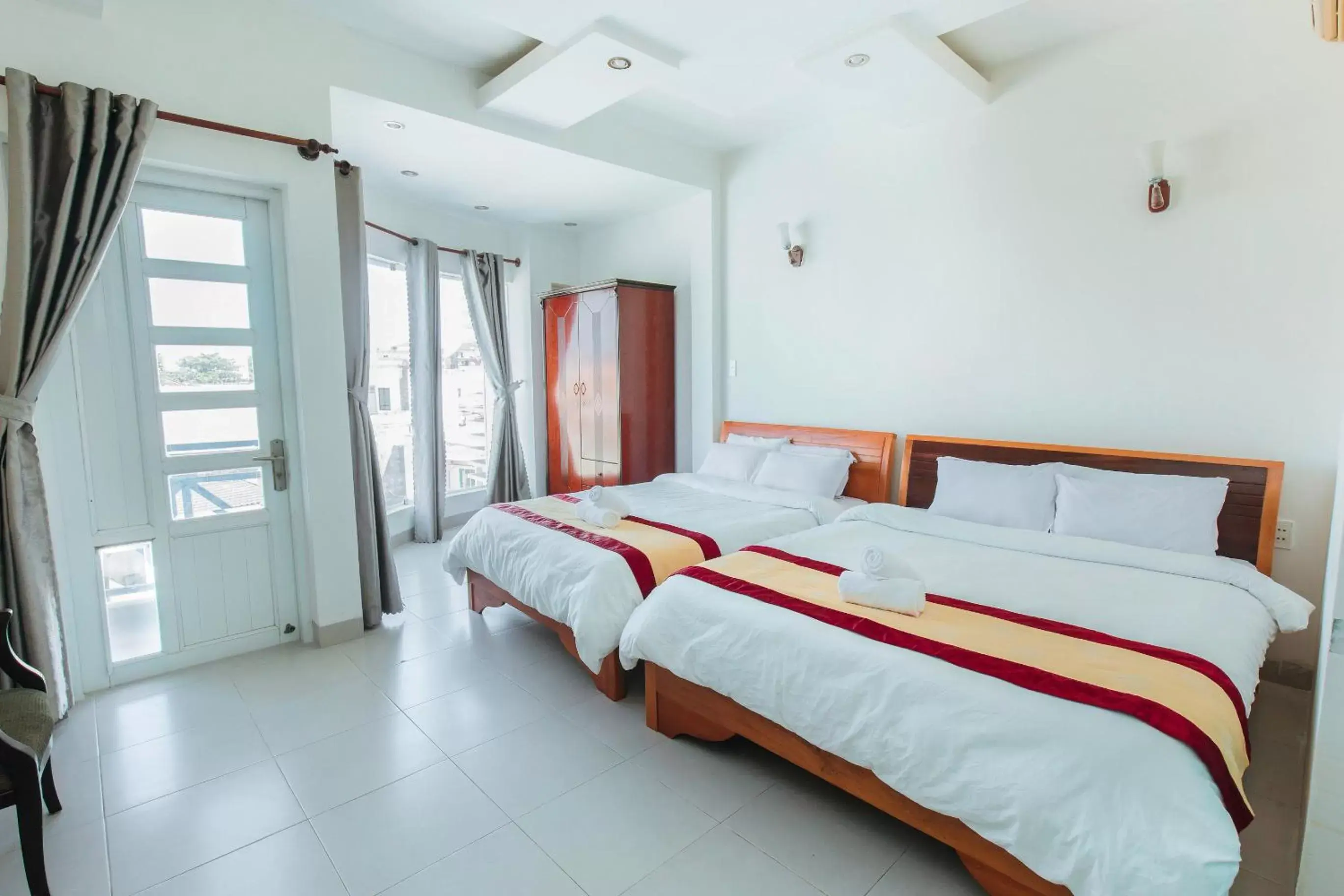 Quadruple Room with Balcony in Phuoc Hai Hotel by The Moment Quadruple Room with Balcony in Phuoc Hai Hotel by The Moment