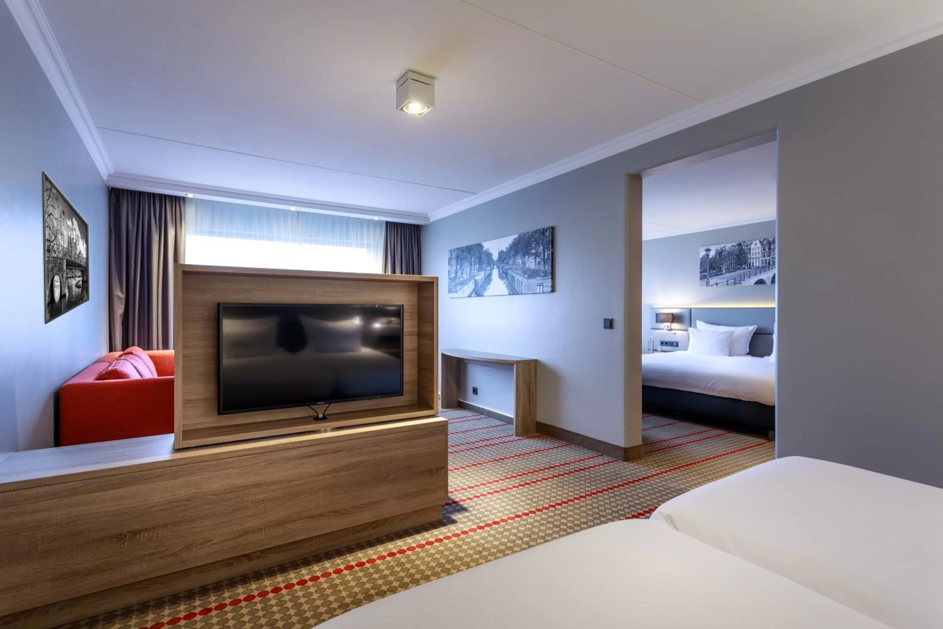 Seating area, Bed in Ramada by Wyndham Amsterdam Airport Schiphol