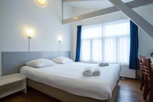 Bed in Hotel Titus City Centre