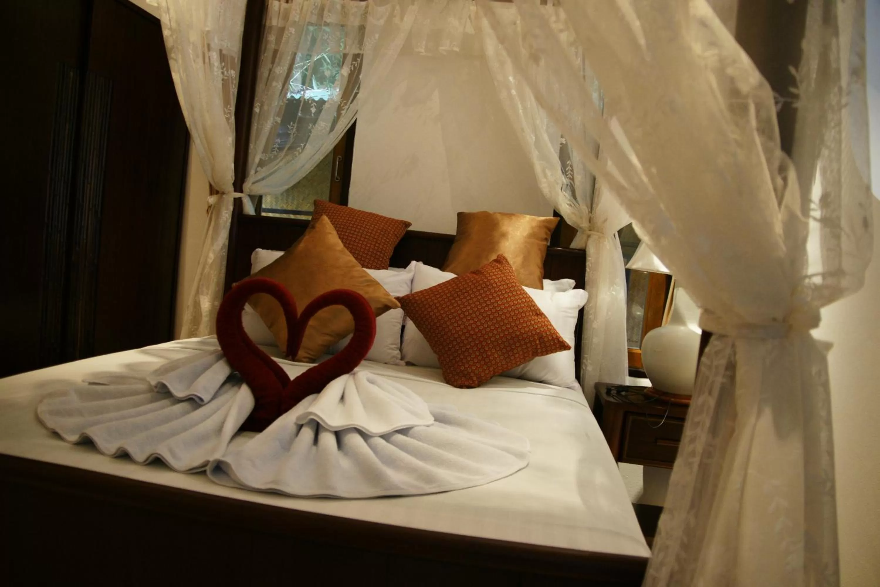 Bed in Jungle Village Bungalow