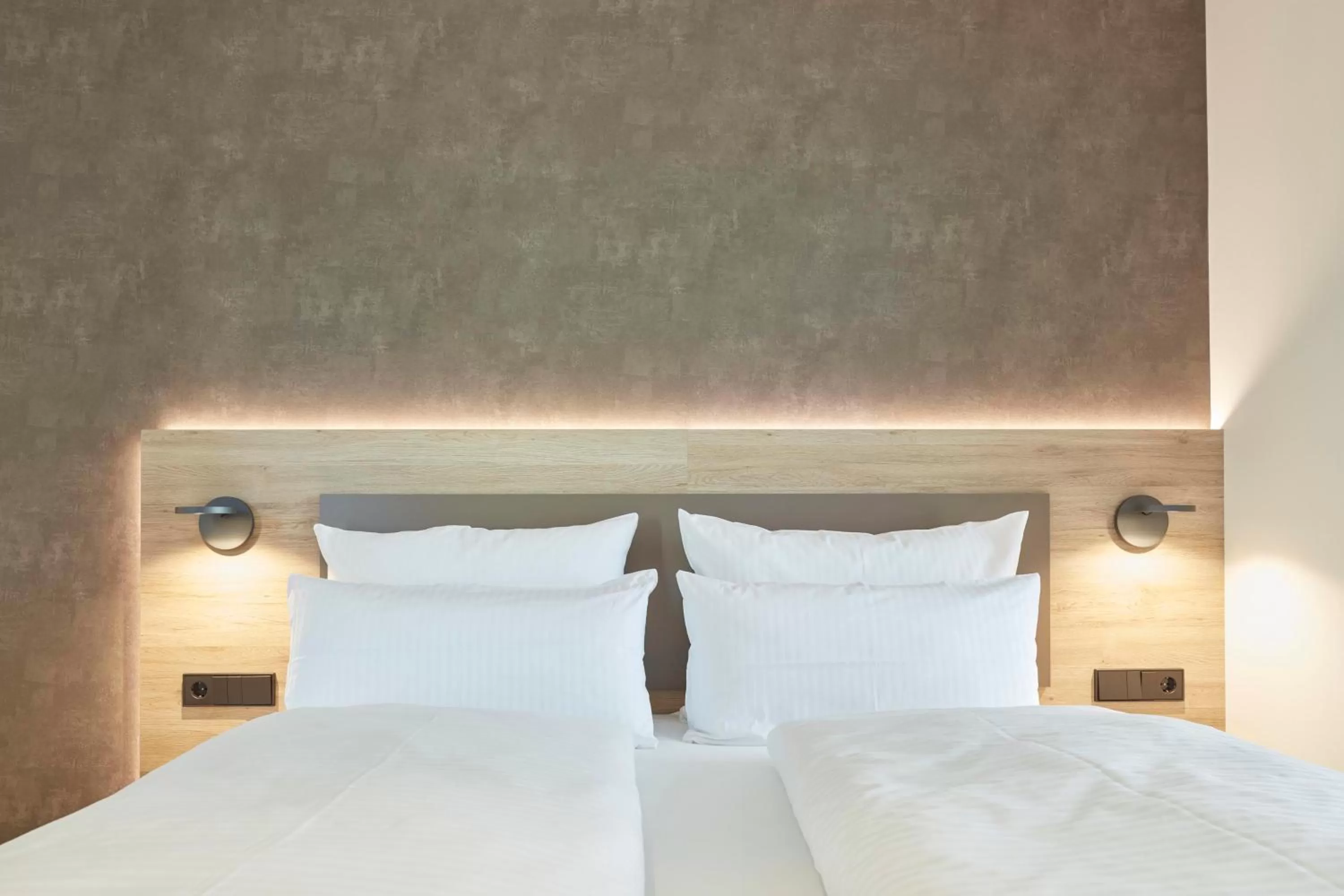 Bed in Gästehaus Bauer - Schlafen auf dem Weingut