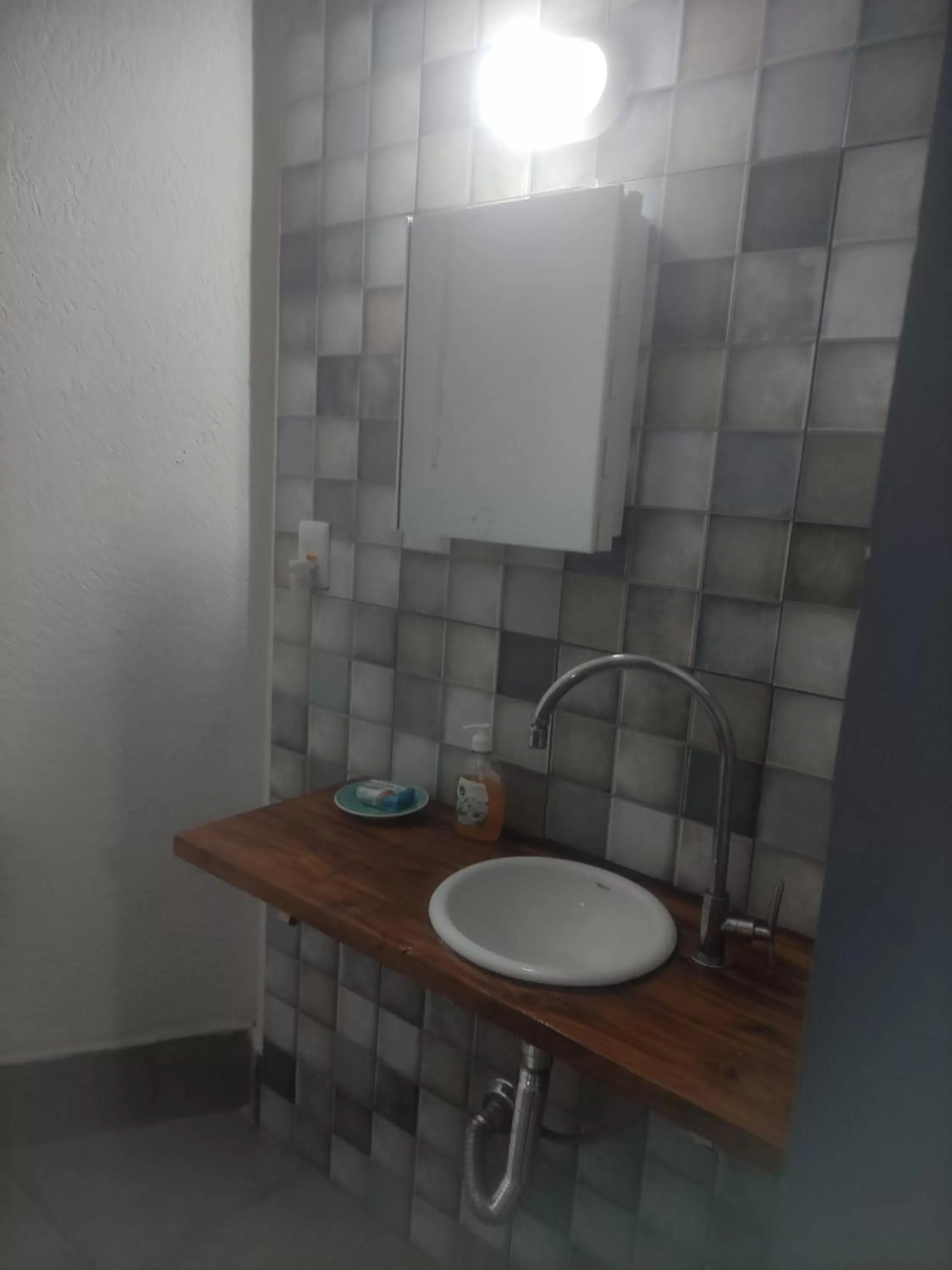 Bathroom in Pousada da Gi Suítes e Turismo