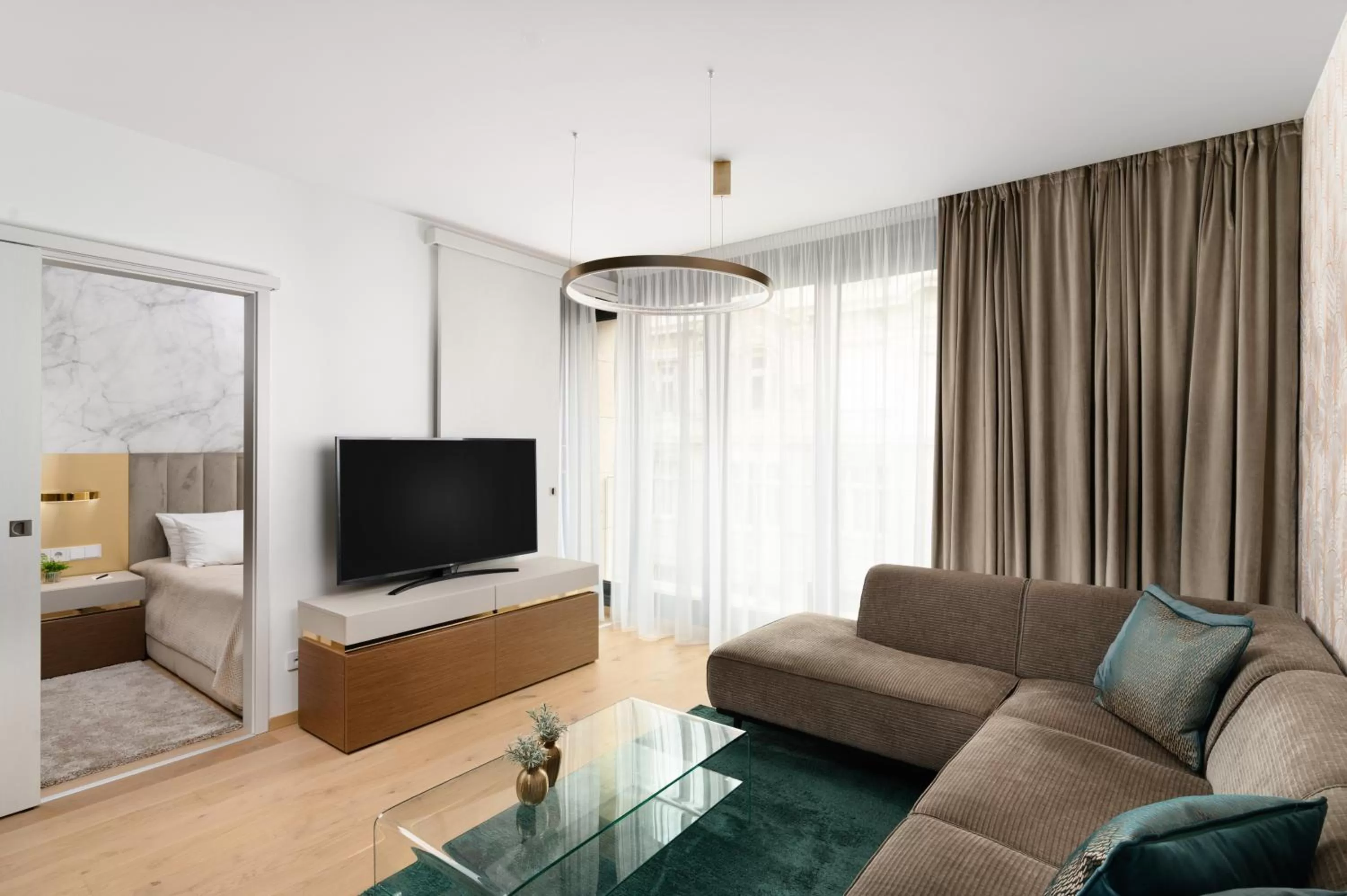 Living room in Emerald Downtown Luxury Suites by Continental Group