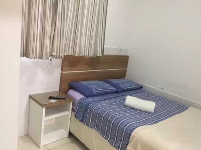 Bed in Pousada Almeida