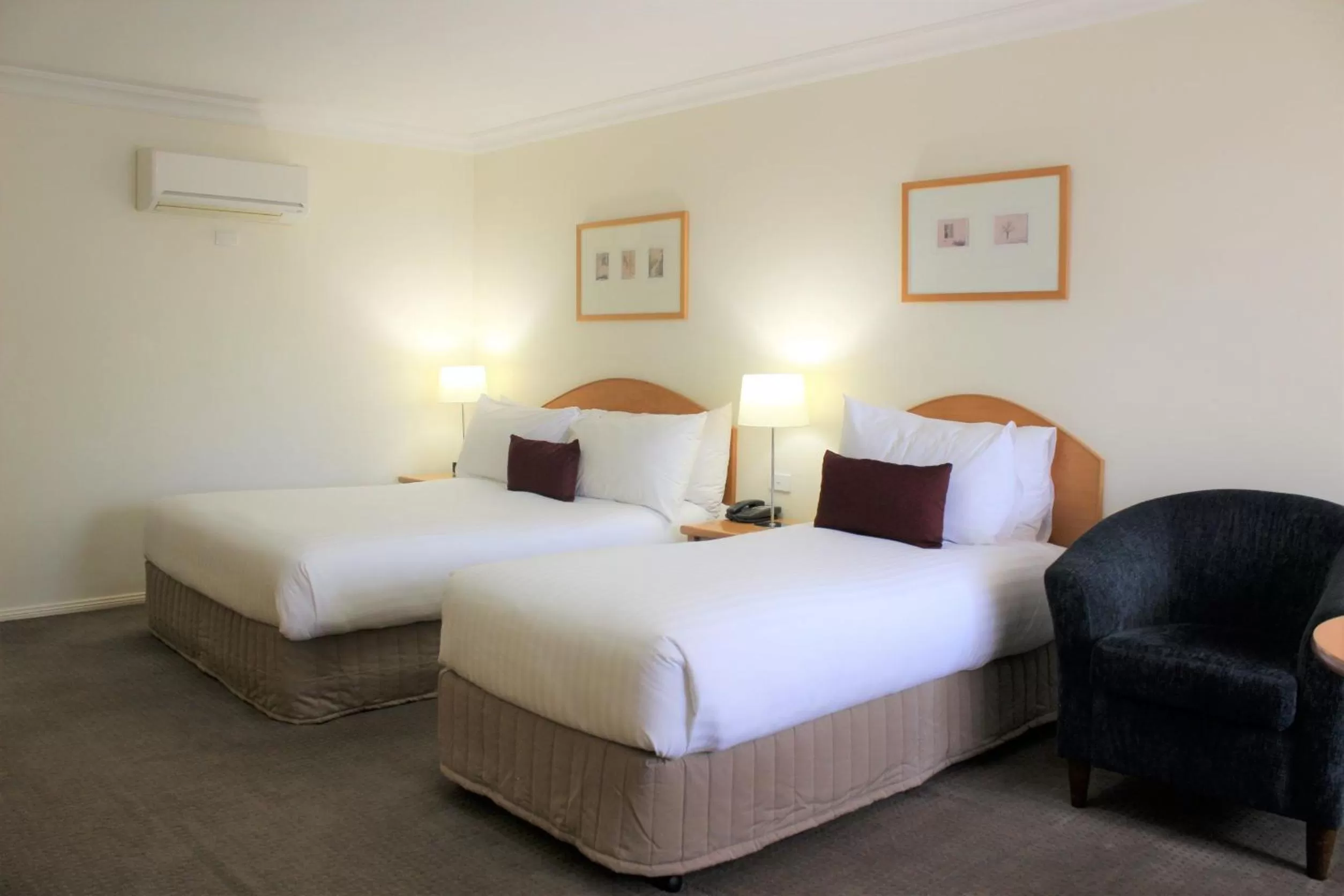 Bed in Carlyle Suites & Apartments