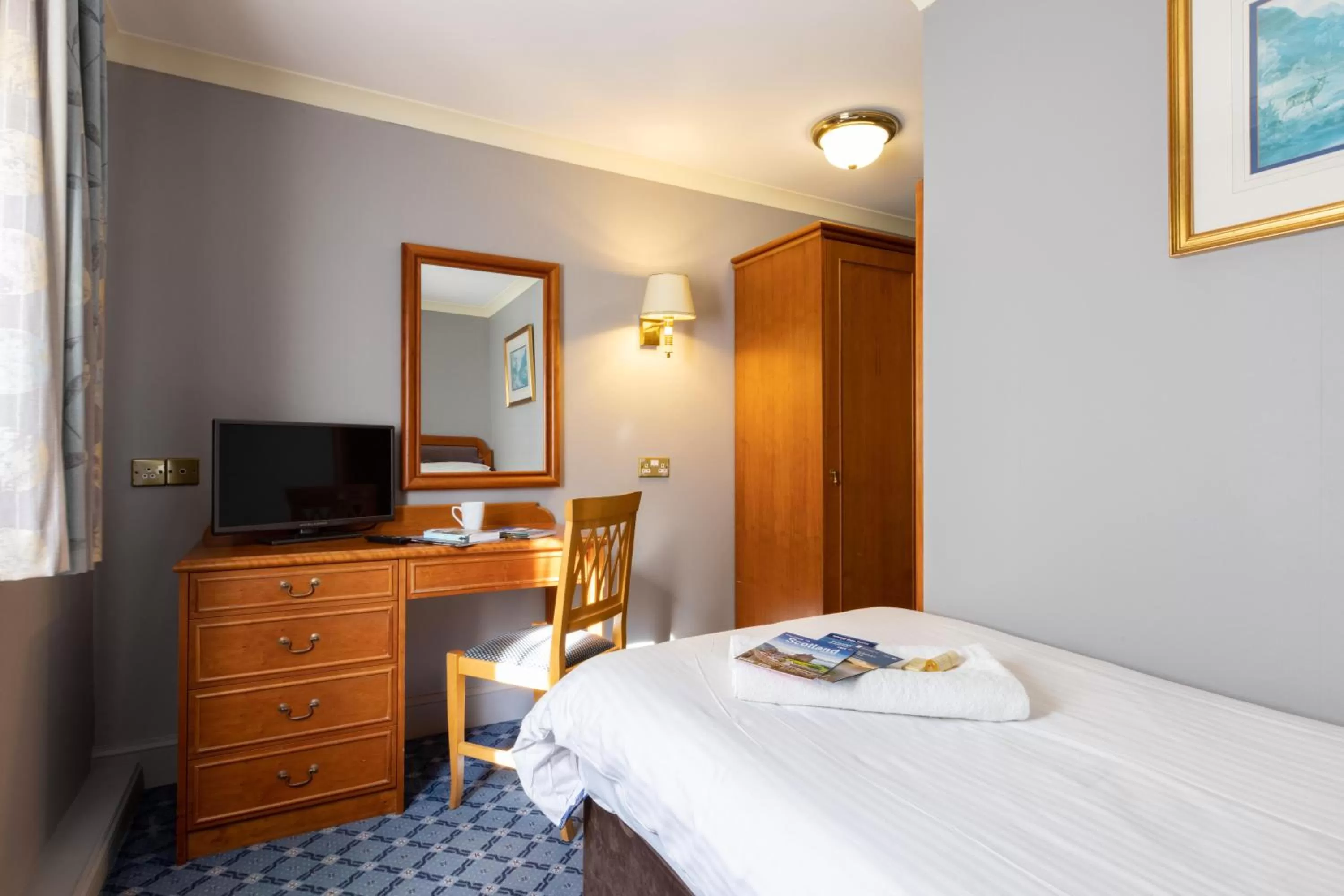 Photo of the whole room, Bed in The Caledonian Hotel