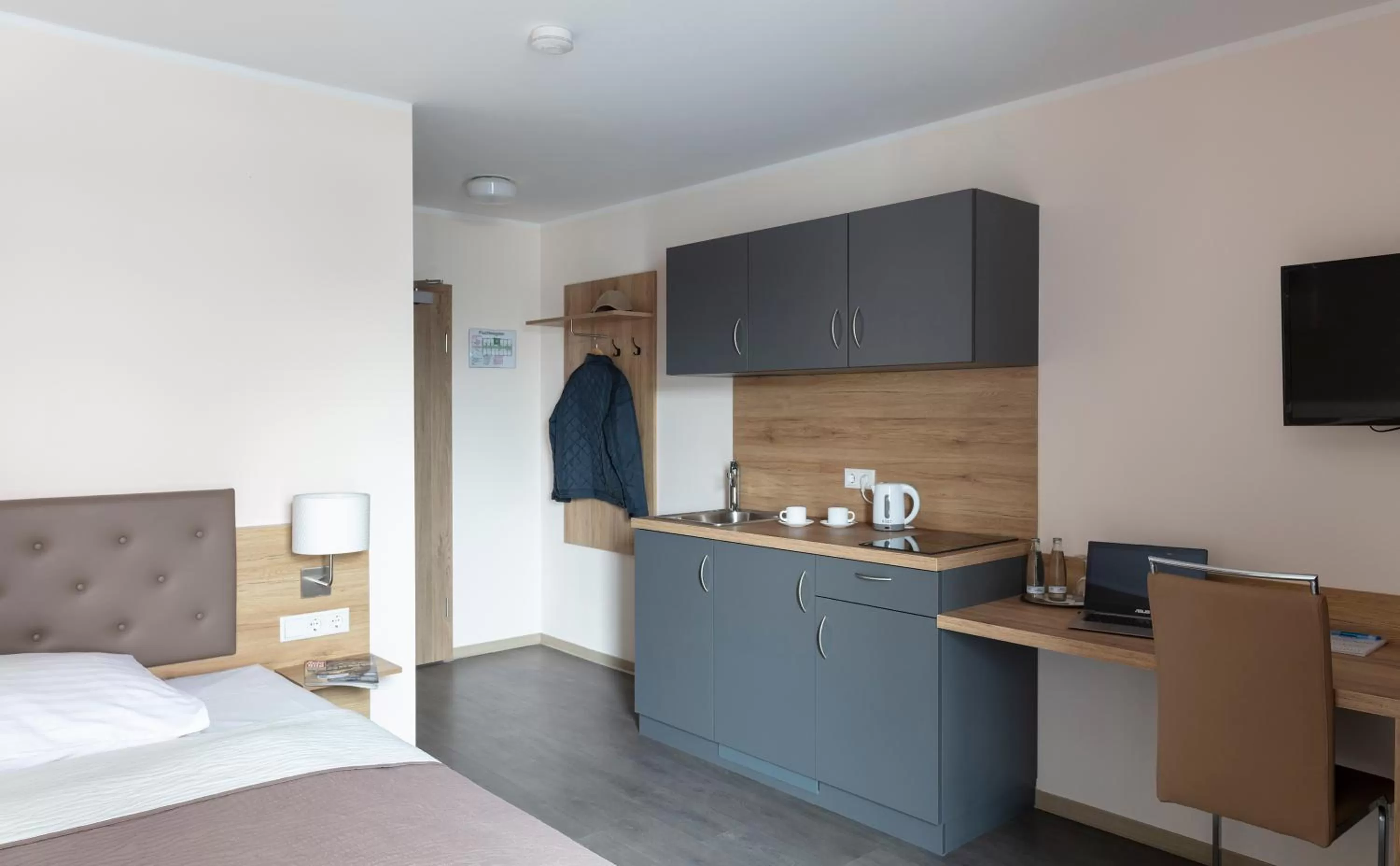 Kitchen or kitchenette, Bed in Dominik Hotel & Eventsaal