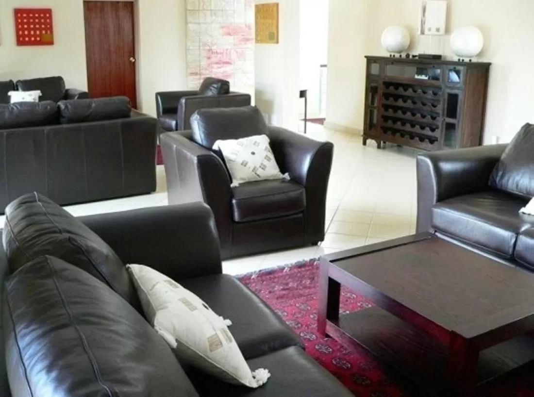 Communal lounge/ TV room in Rustenburg Boutique Hotel