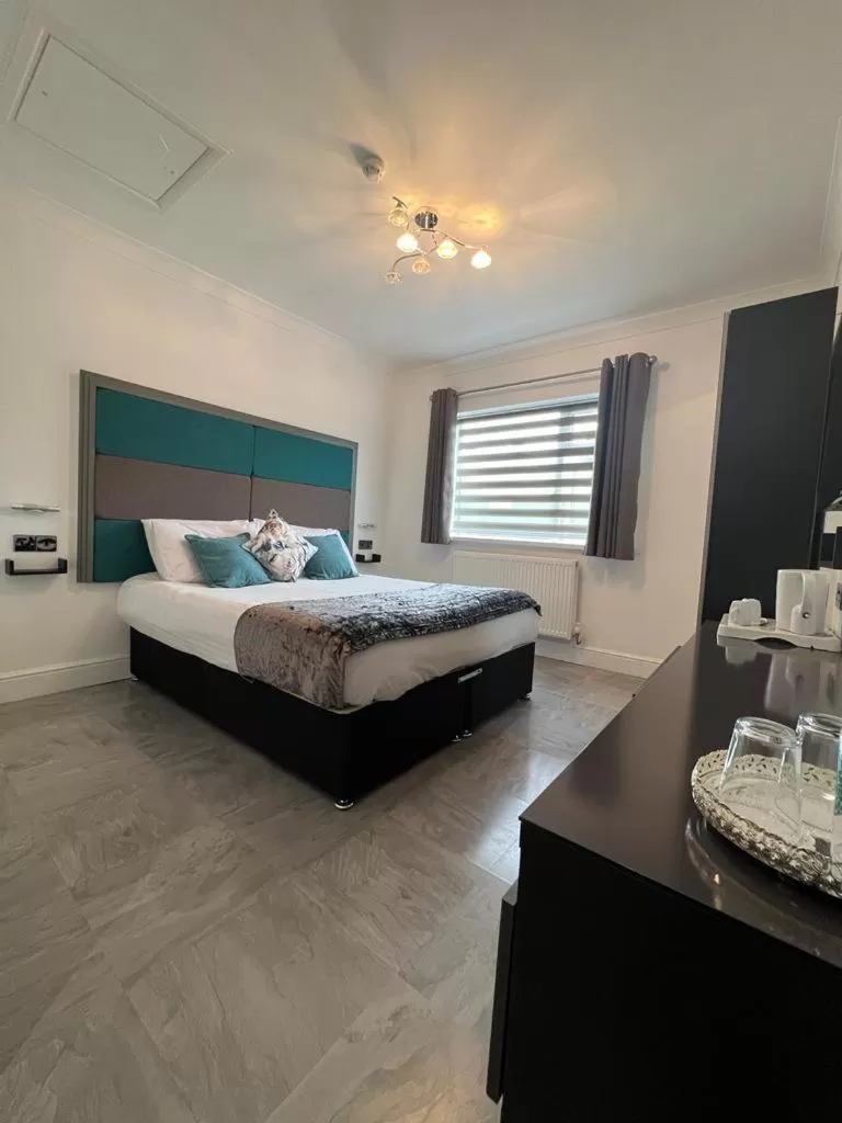 Bed in Charnwood Regency Guest House