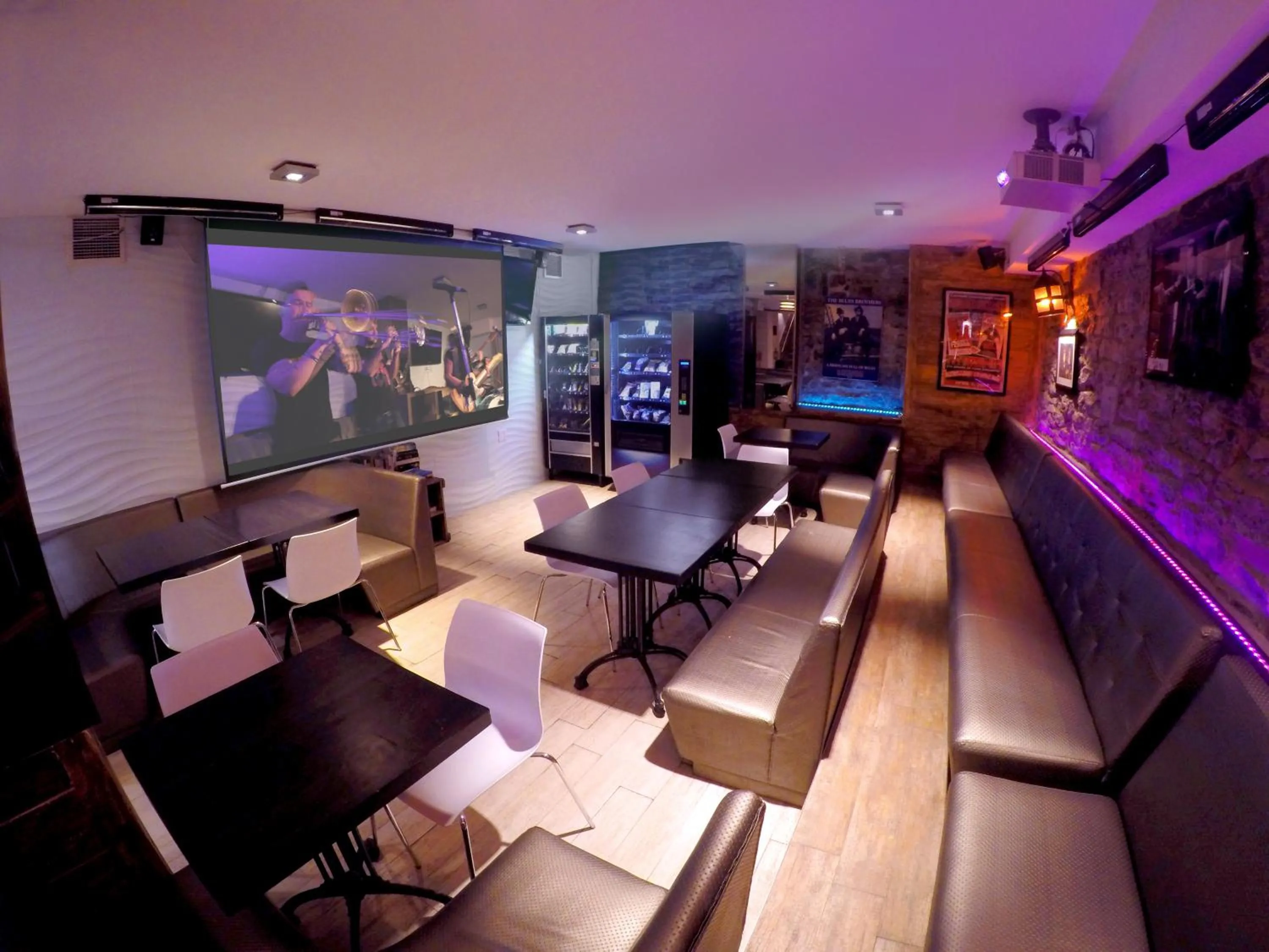 Communal lounge/ TV room in M Montreal Hostel