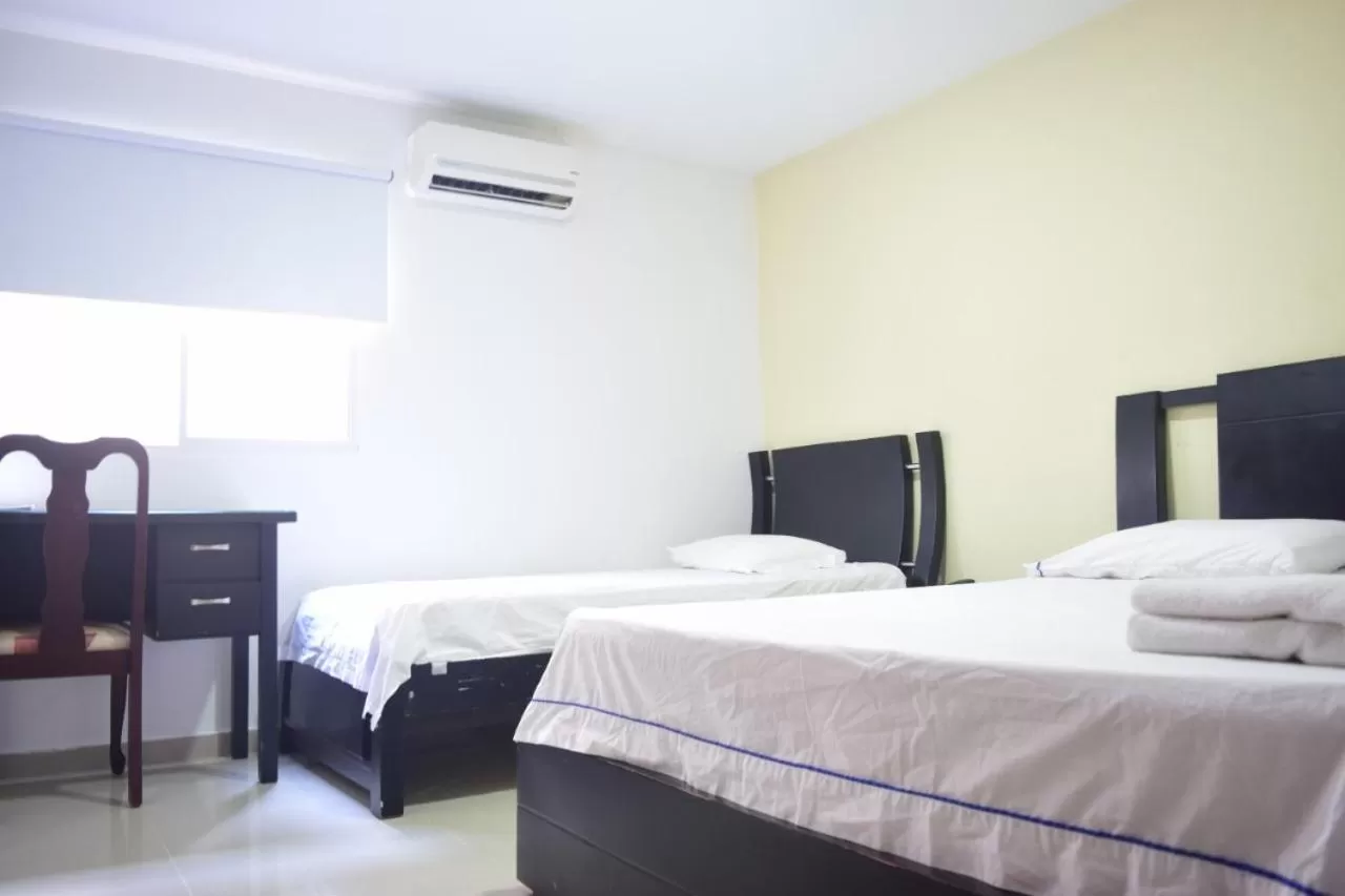 Bed in Hotel Intersuites