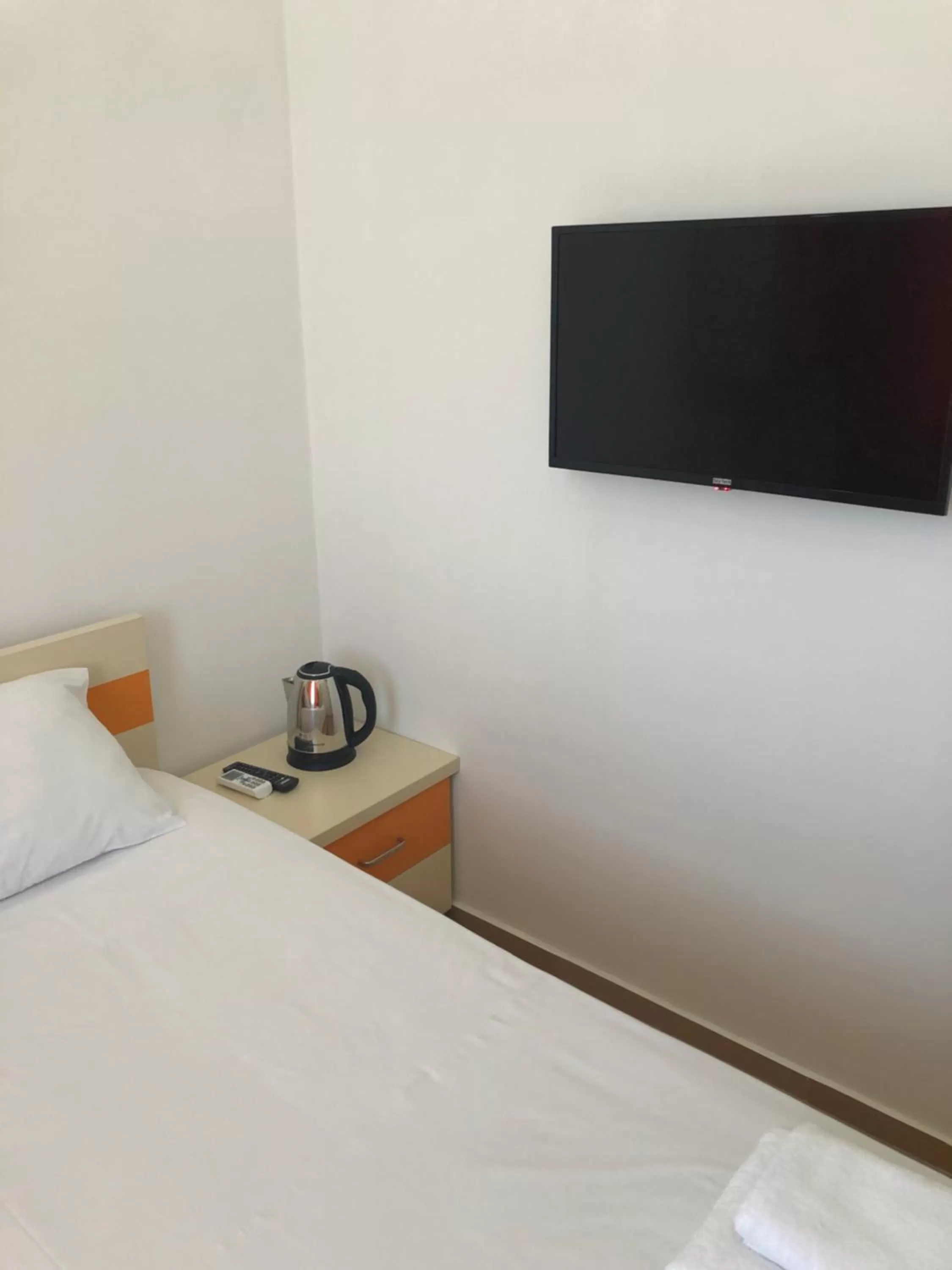 TV/Entertainment Center in Orange Home Hotel