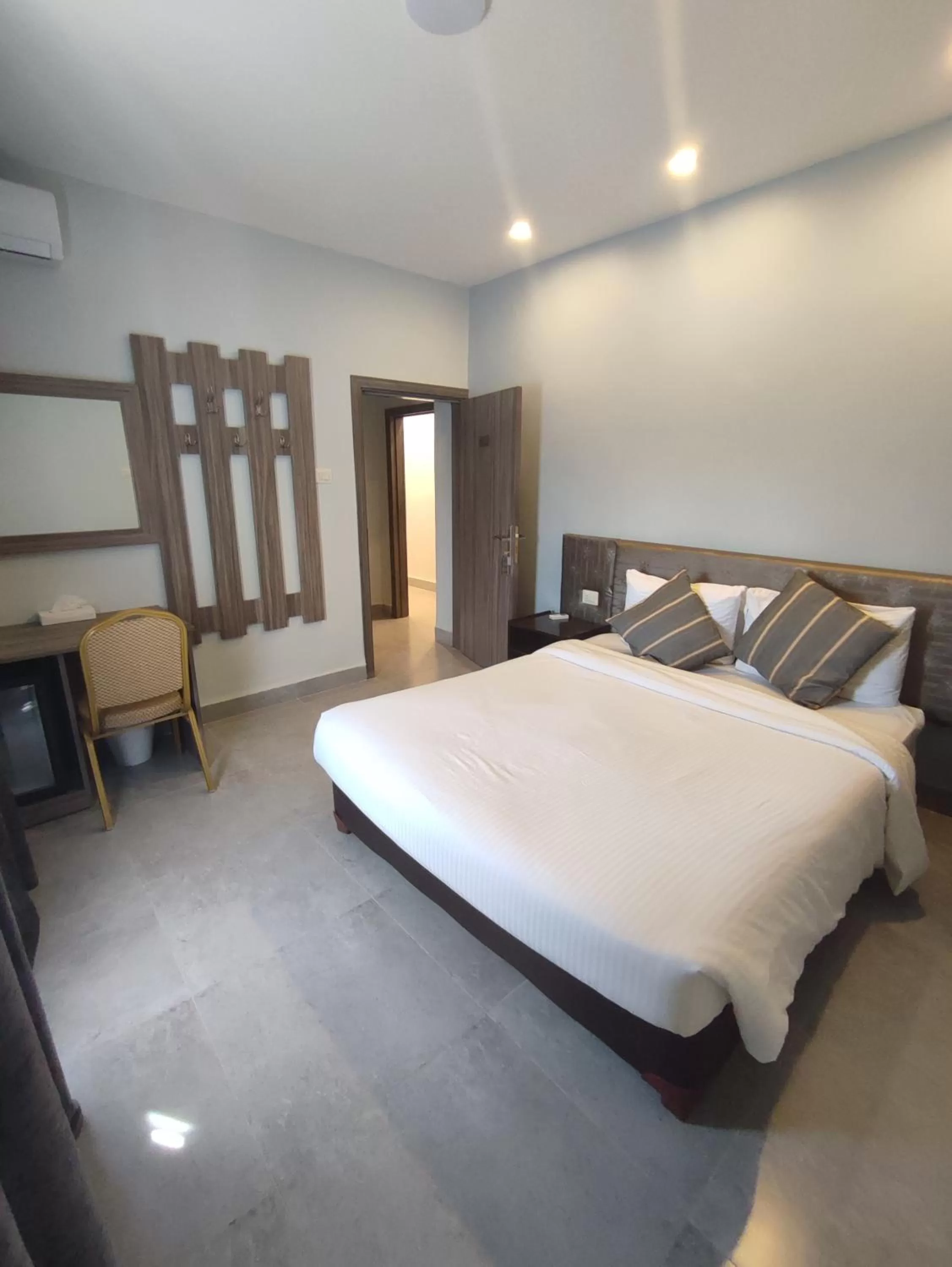 Bed in Black Iris Hotel