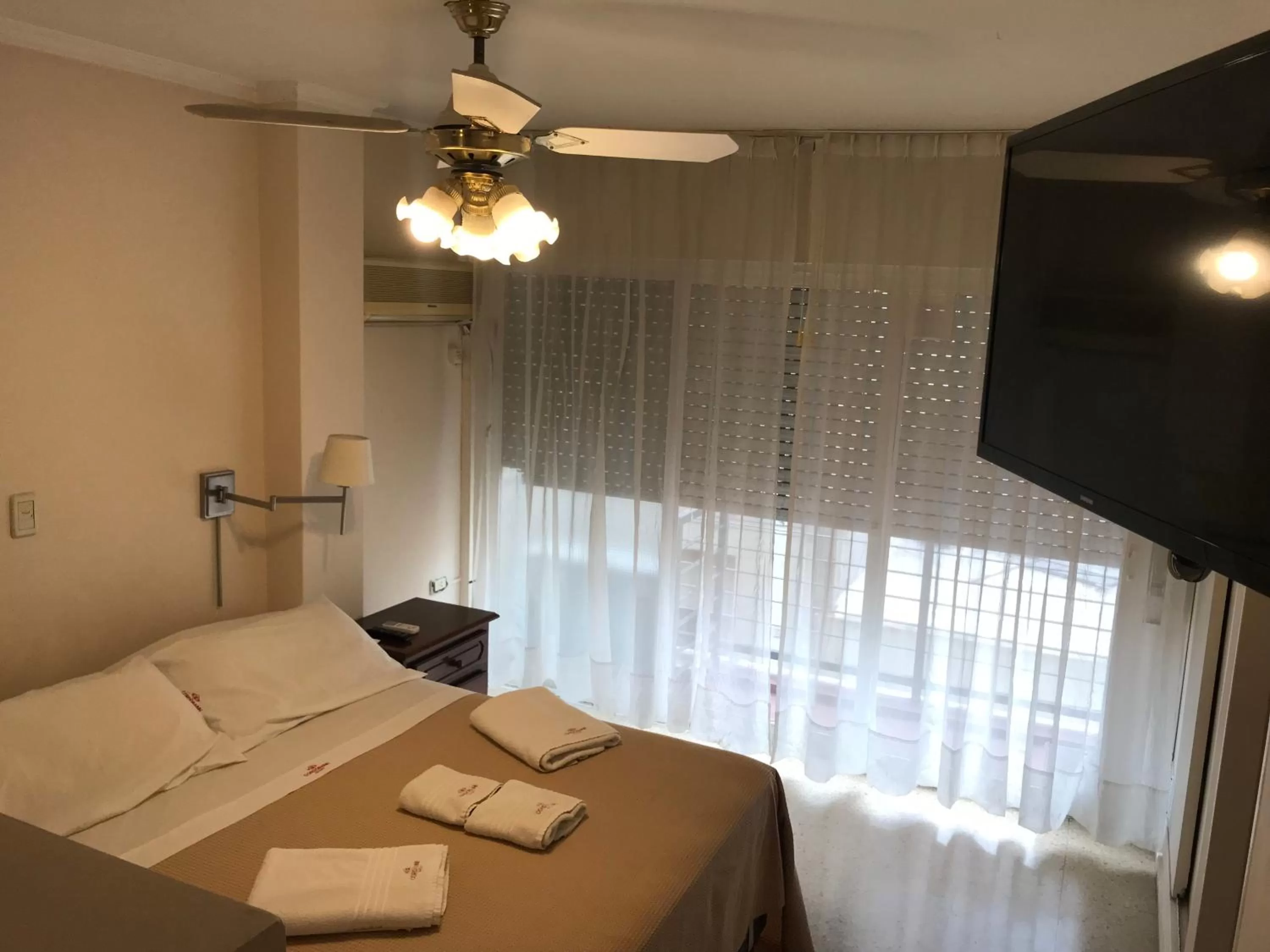 Bed in Cordoba Inn Apart Hotel