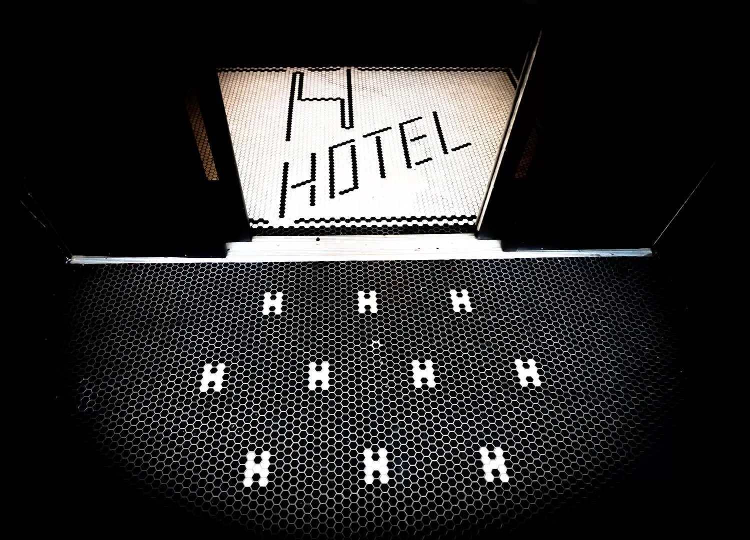 Property logo or sign in H by H Hospitality