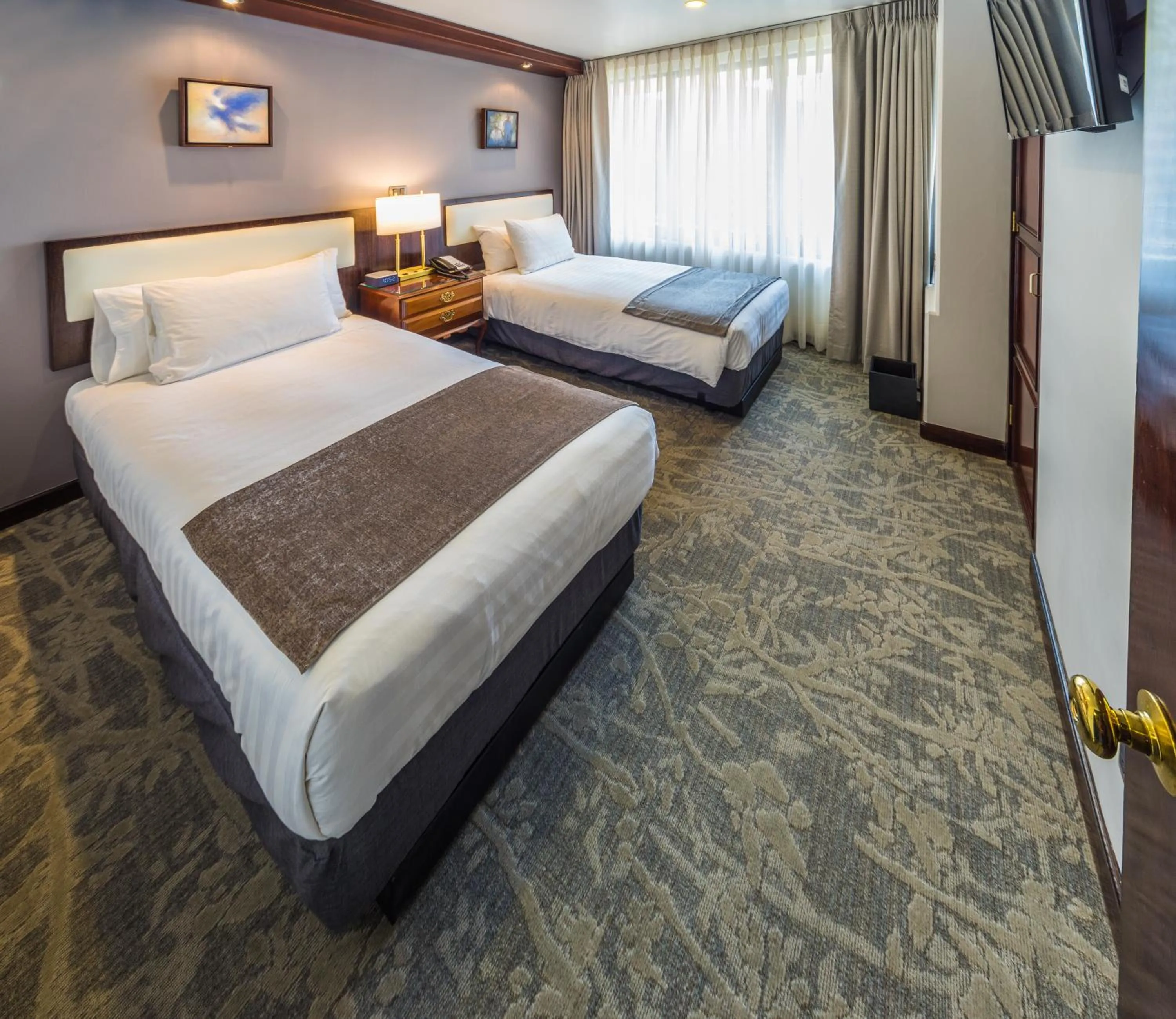 Bed in Ritz Apart Hotel