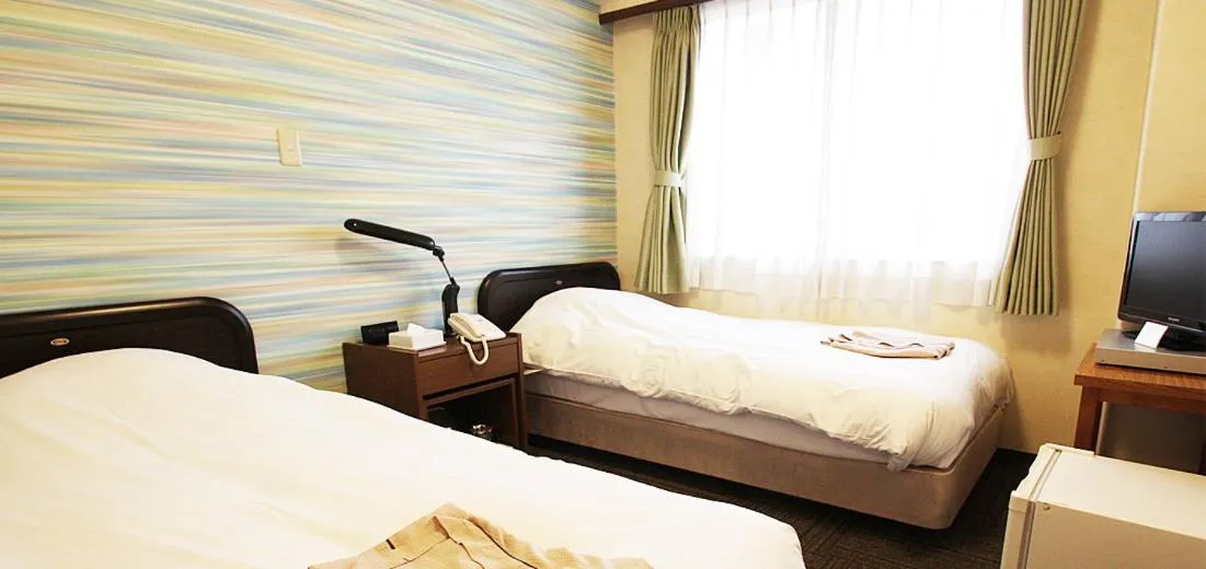 Bed in Takamatsu City Hotel