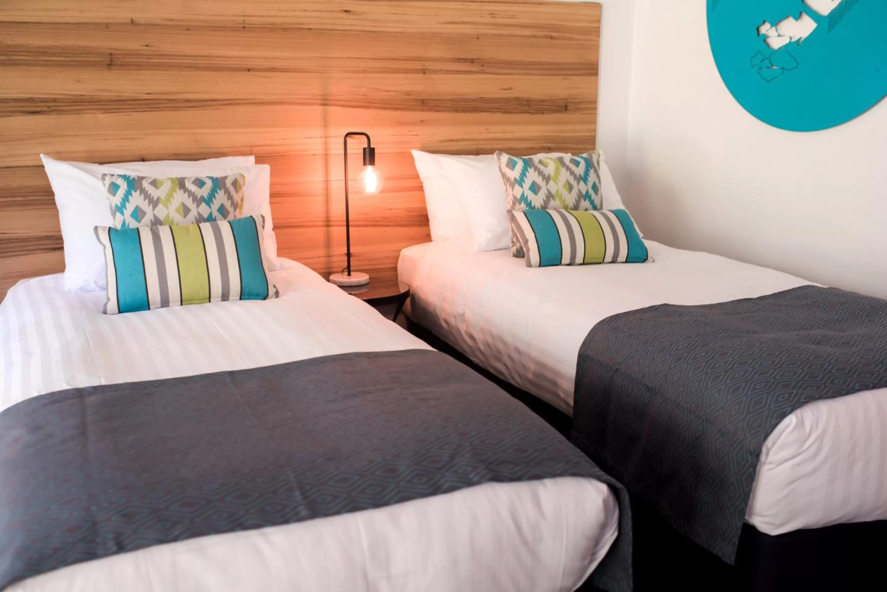 Bed in Bright Colonial Motel