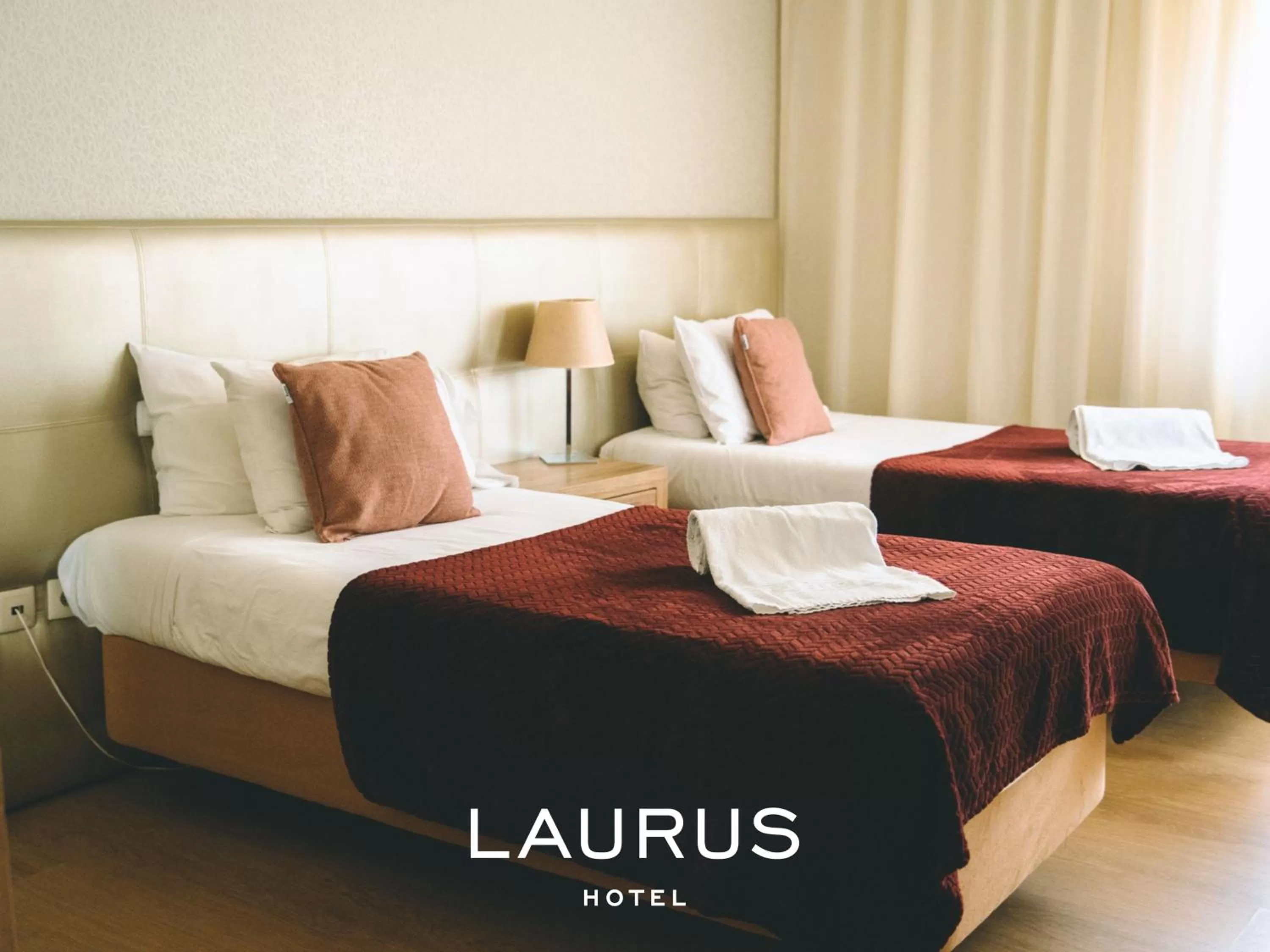 Bed in Laurus Hotel