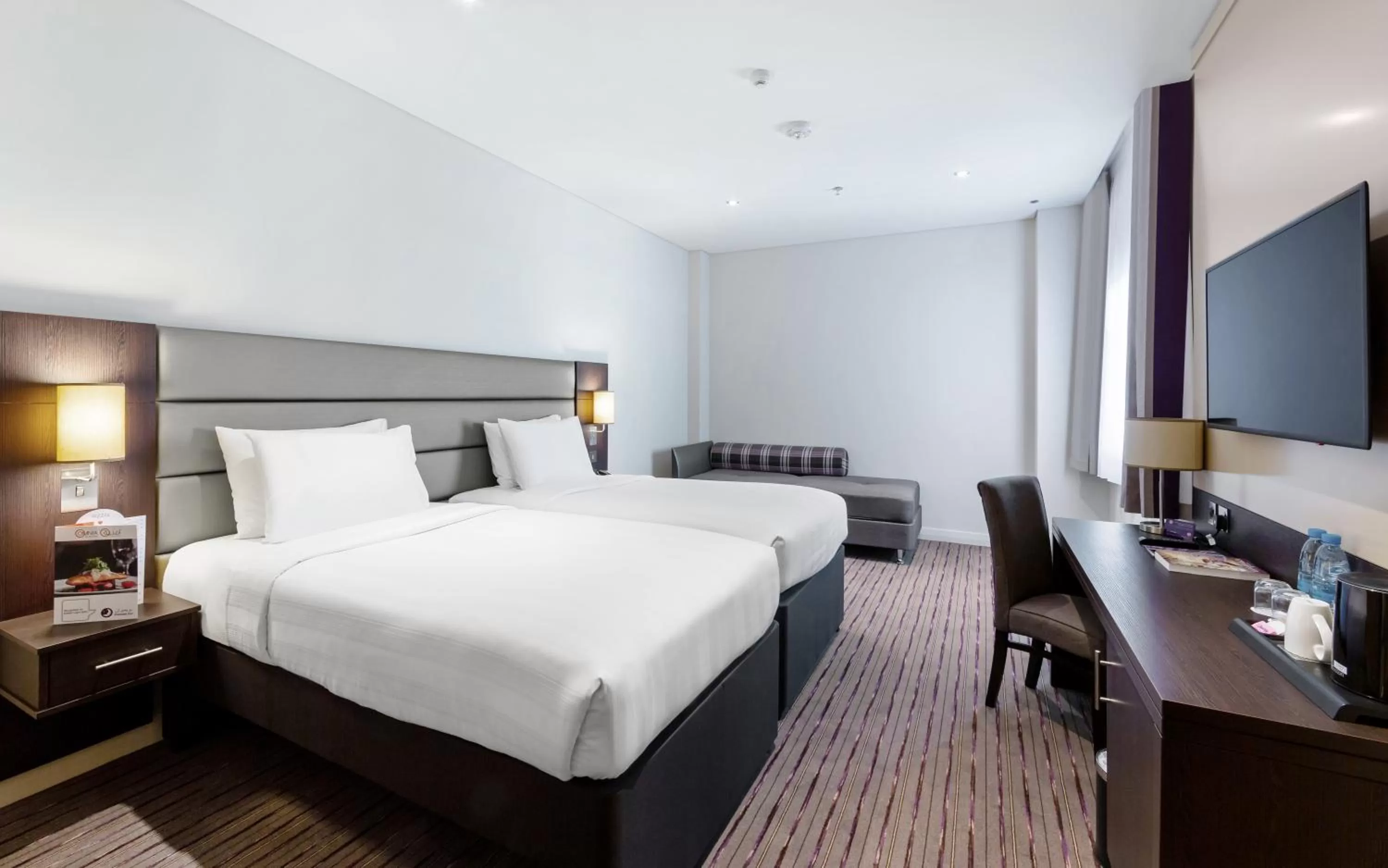 Bed in Premier Inn Doha Airport